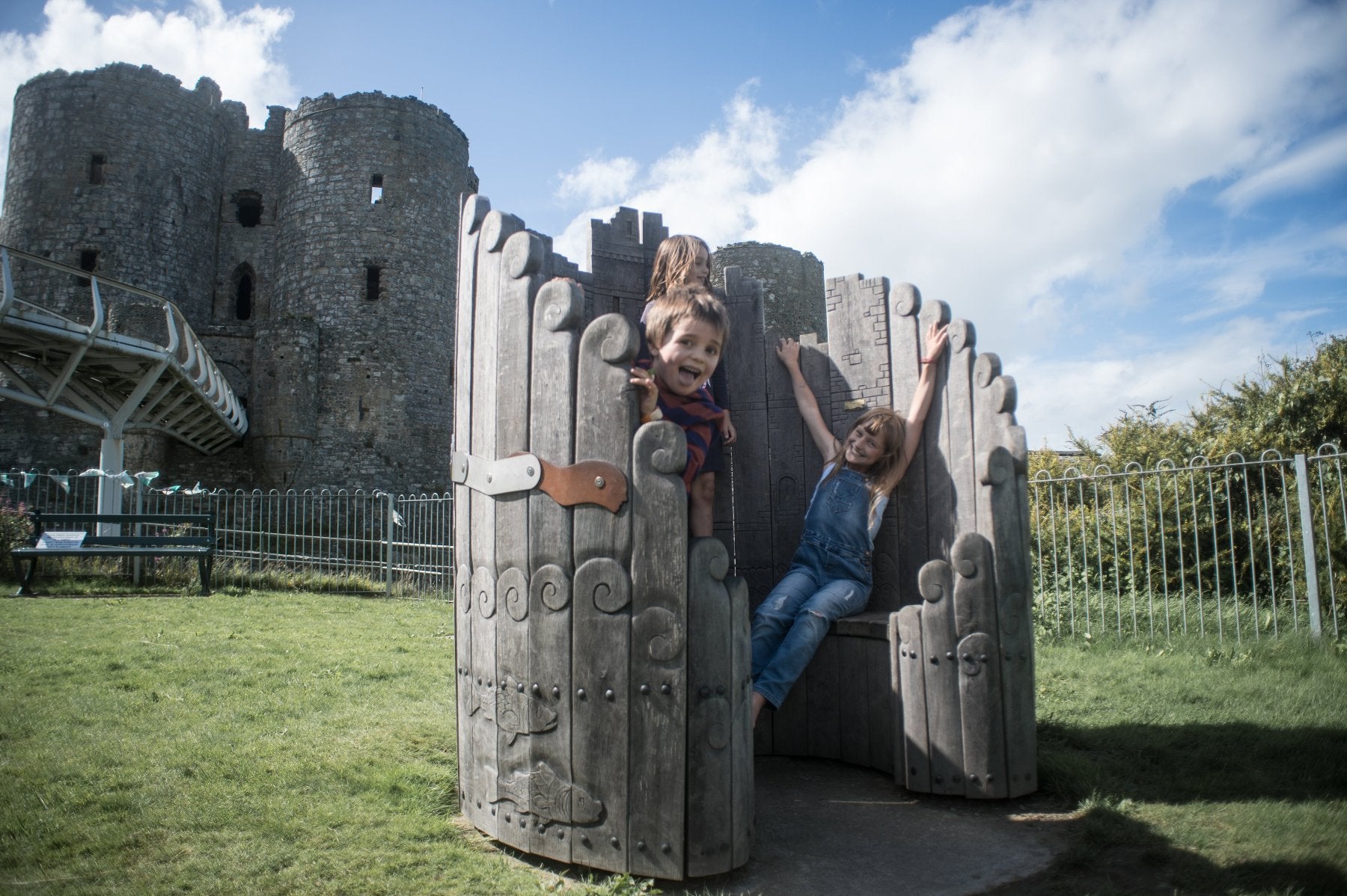 Picture of happy kids on Harlech Castle chair