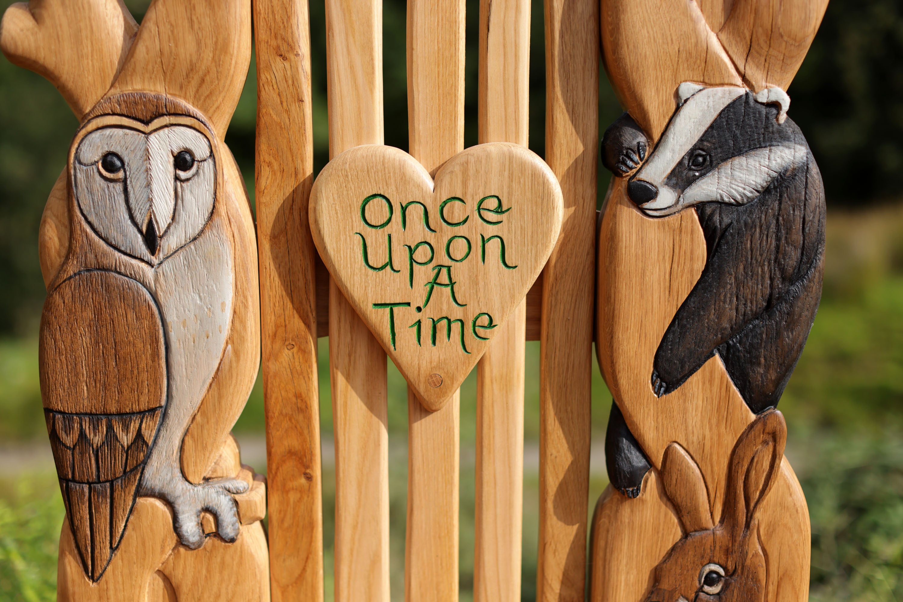 Wooden spoons with animal carvings and 'Once Upon A Time' text