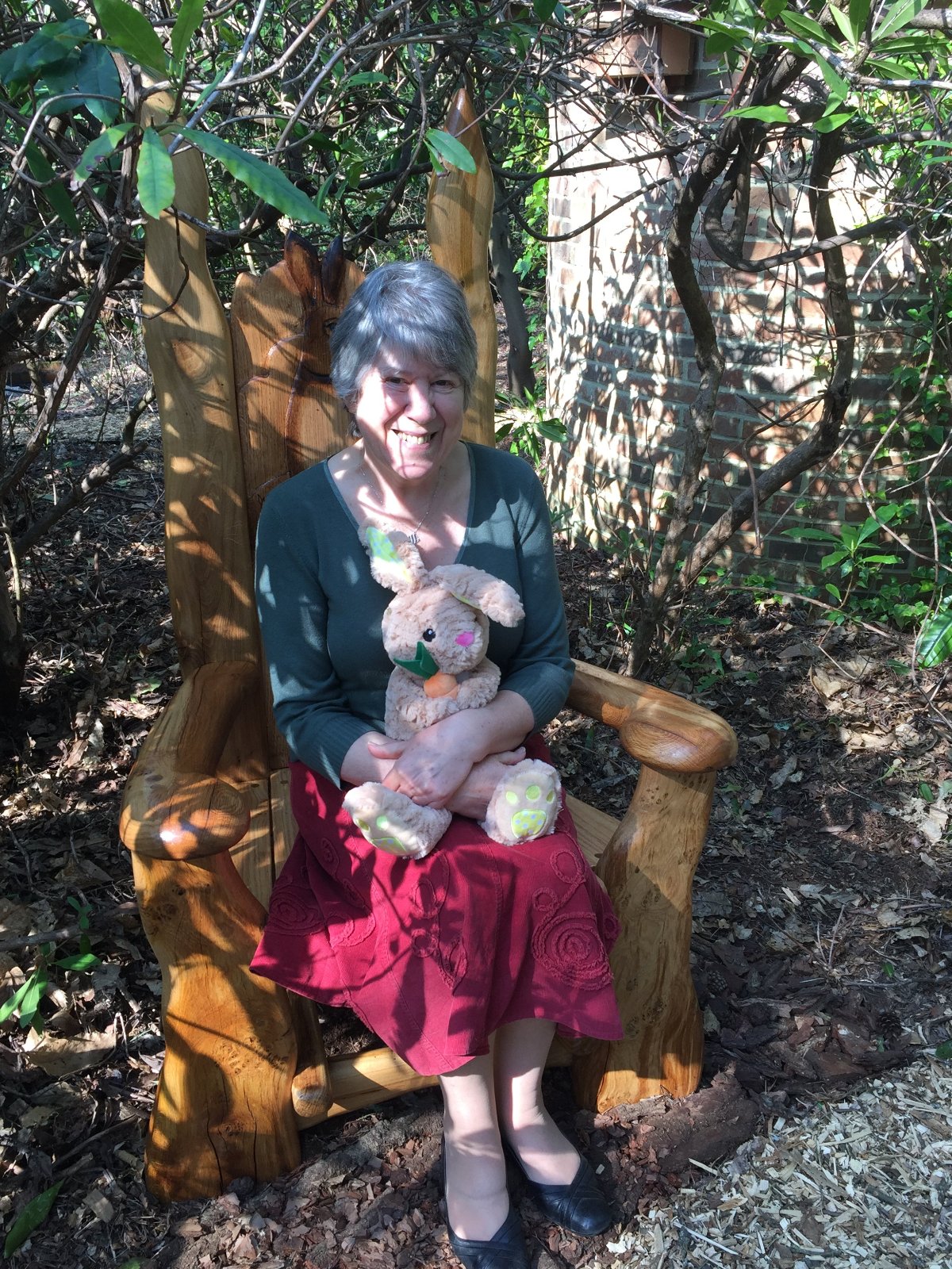 My Wide sitting on the storytellers throne in our garden