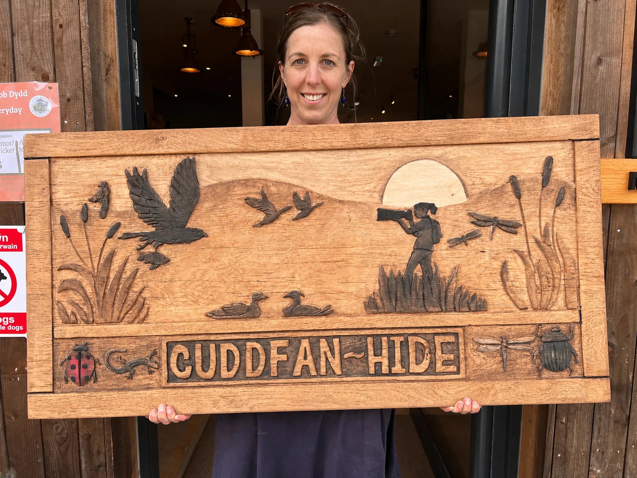 Bespoke oak Cuddfan Hide sign delivered to the Osprey Centre — hand-carved wildlife scene in solid oak