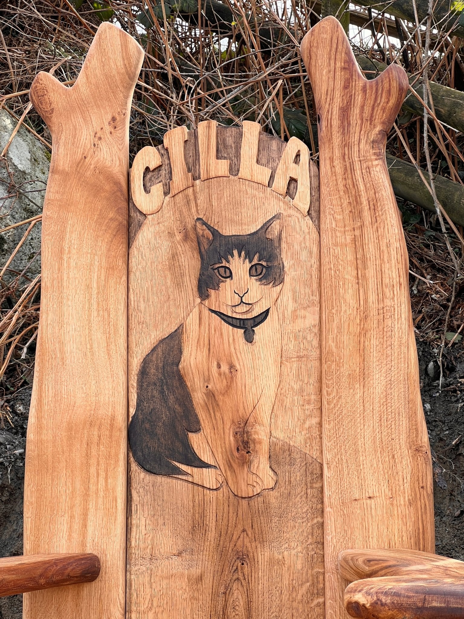 Bespoke tribute chair for school garden featuring engraved image of school cat