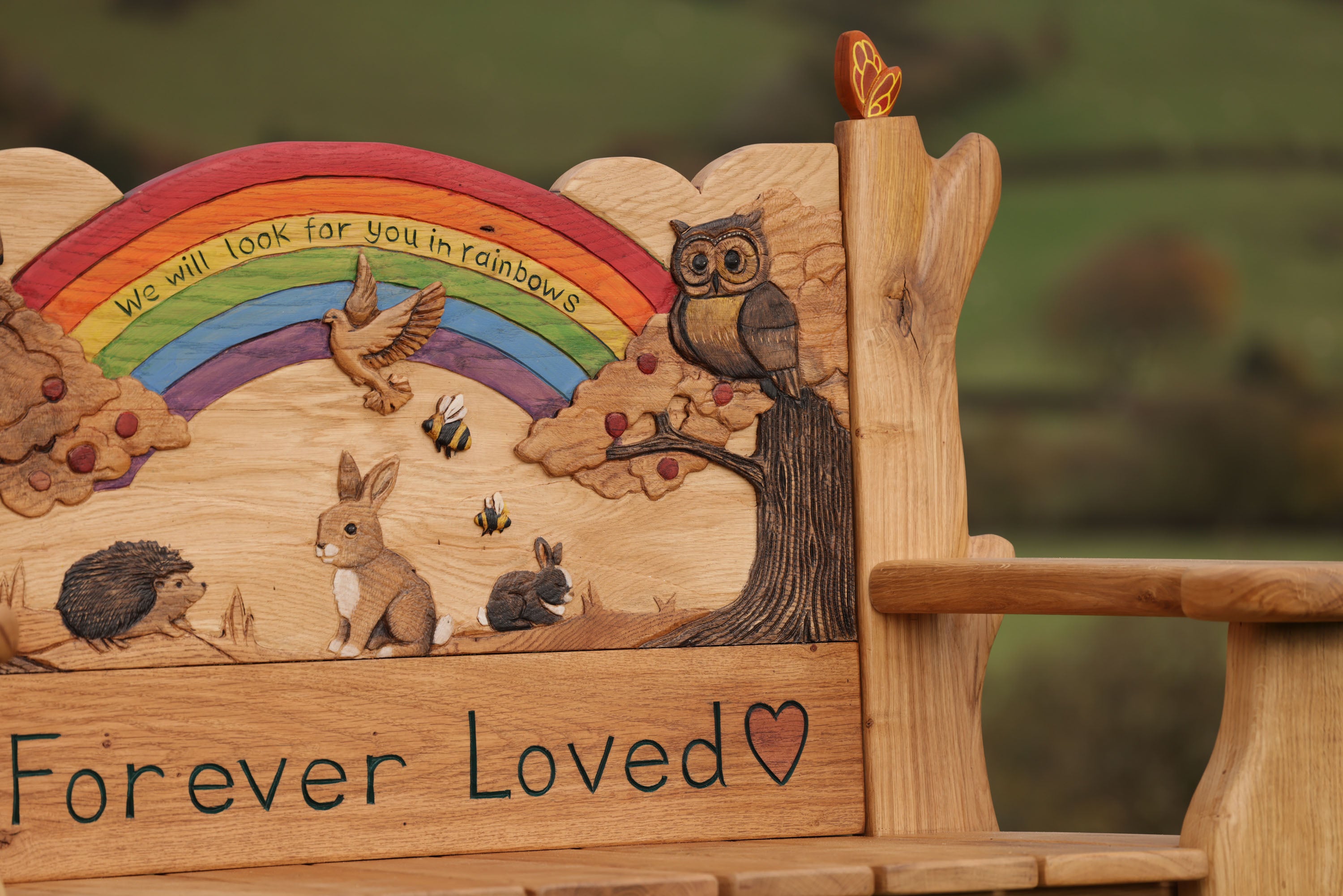handcarved oak bench with rainbow inscription we will look for you in rainbows