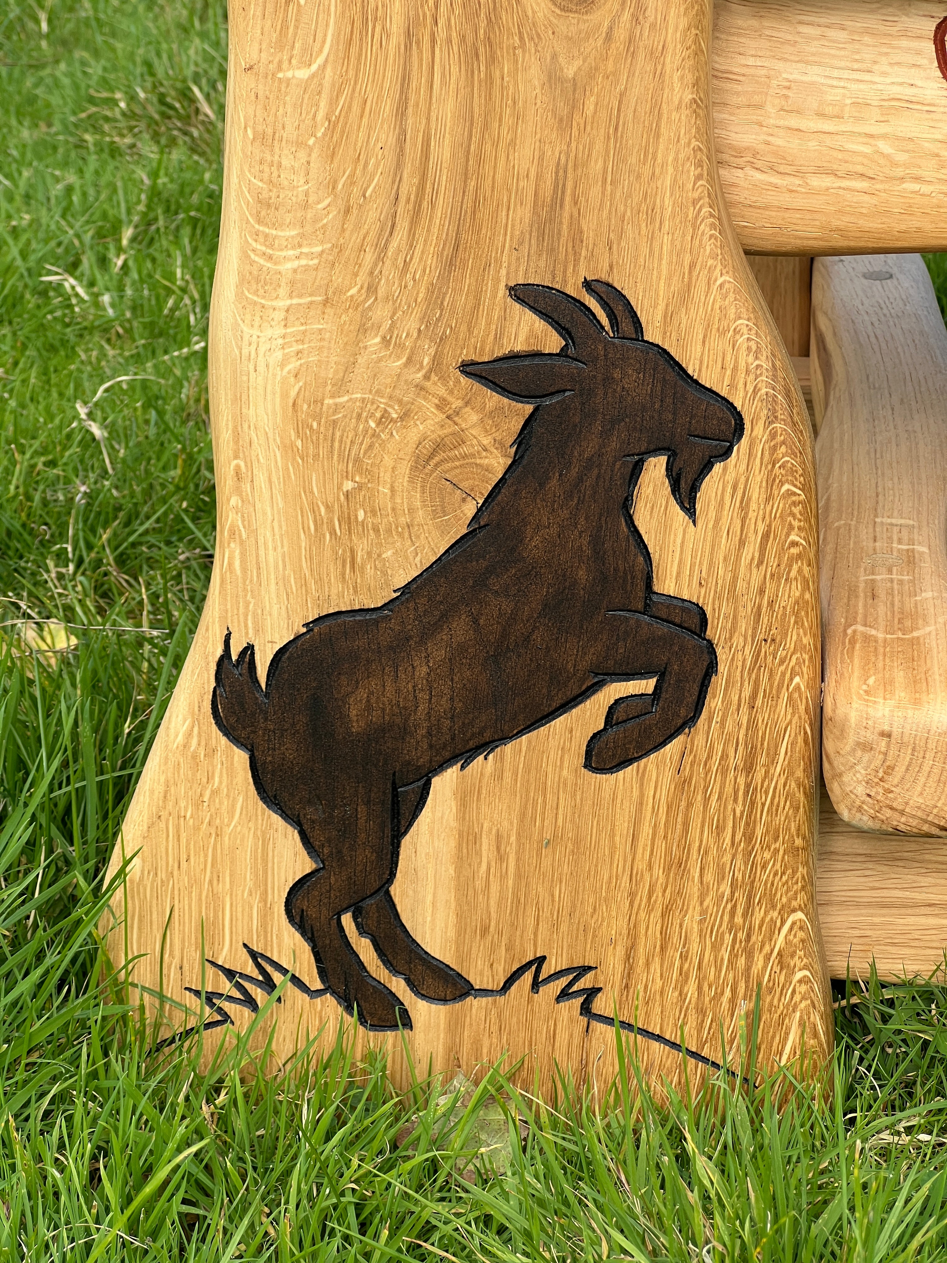 carved goat on bench