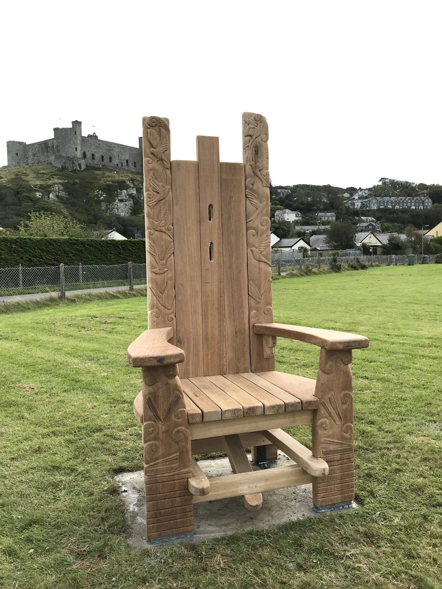 Hand-carved oak storytelling throne freshly installed at Harlech with golden oak finish | solid Welsh oak