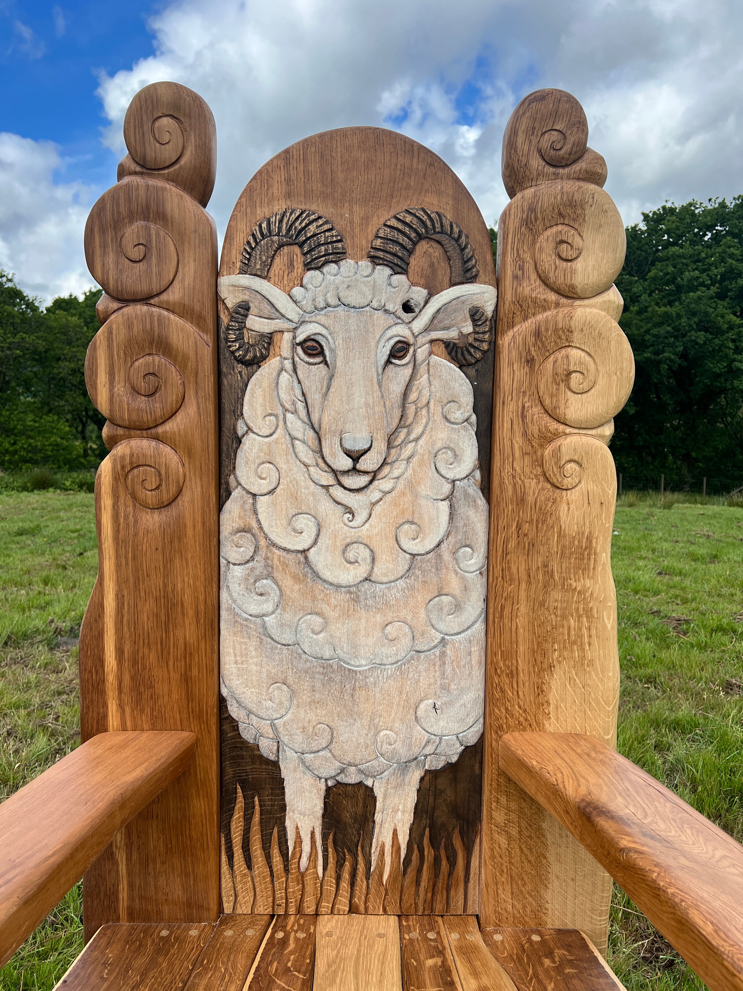 Close-up of carved Swaledale sheep on chair back