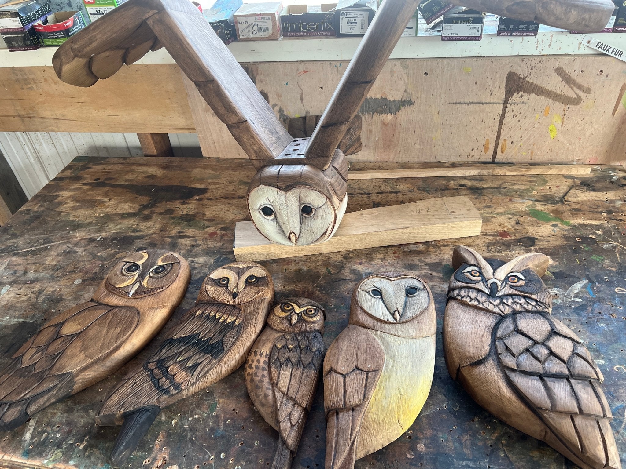 carved wooden owls for archway