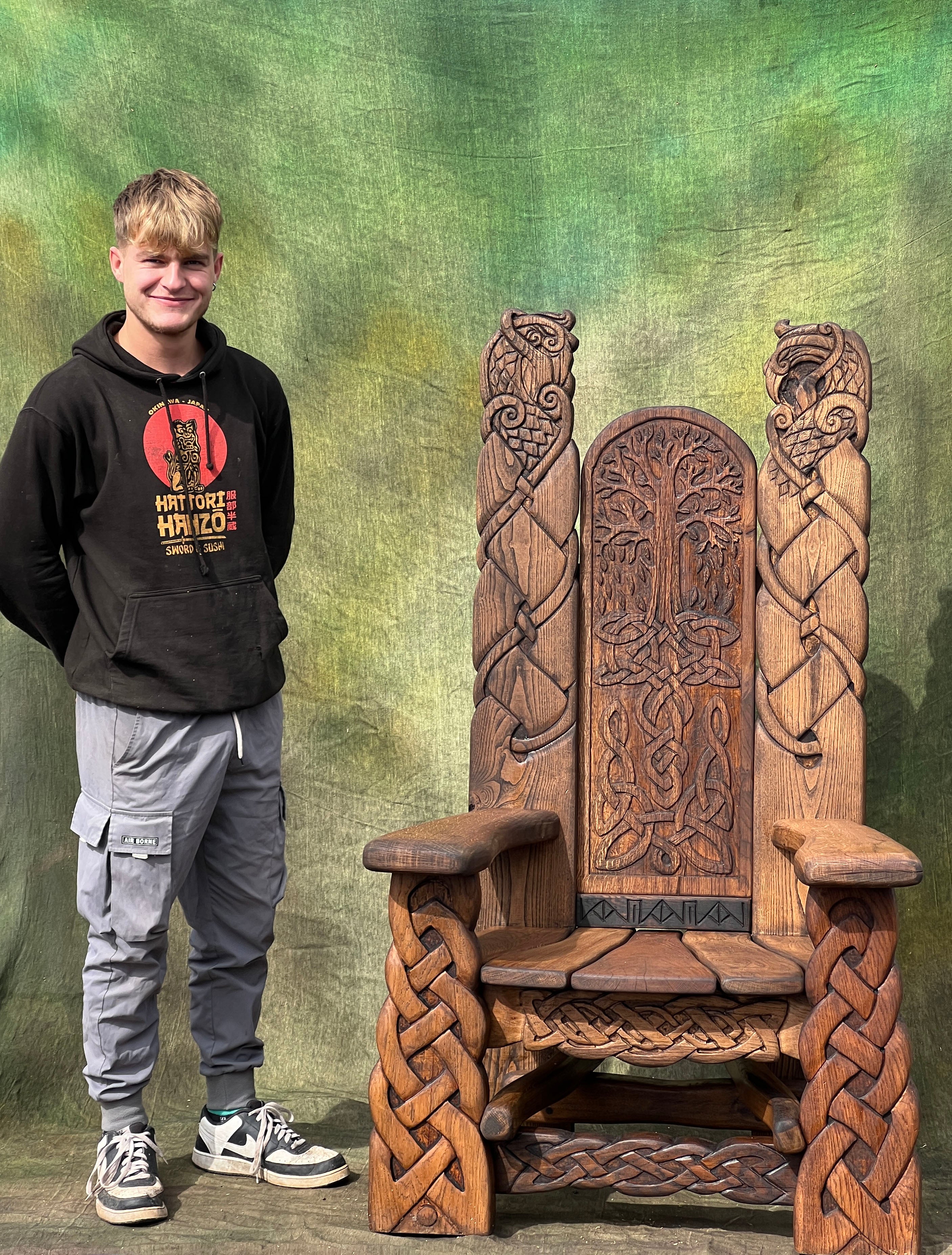 large viking throne chair scale next to person