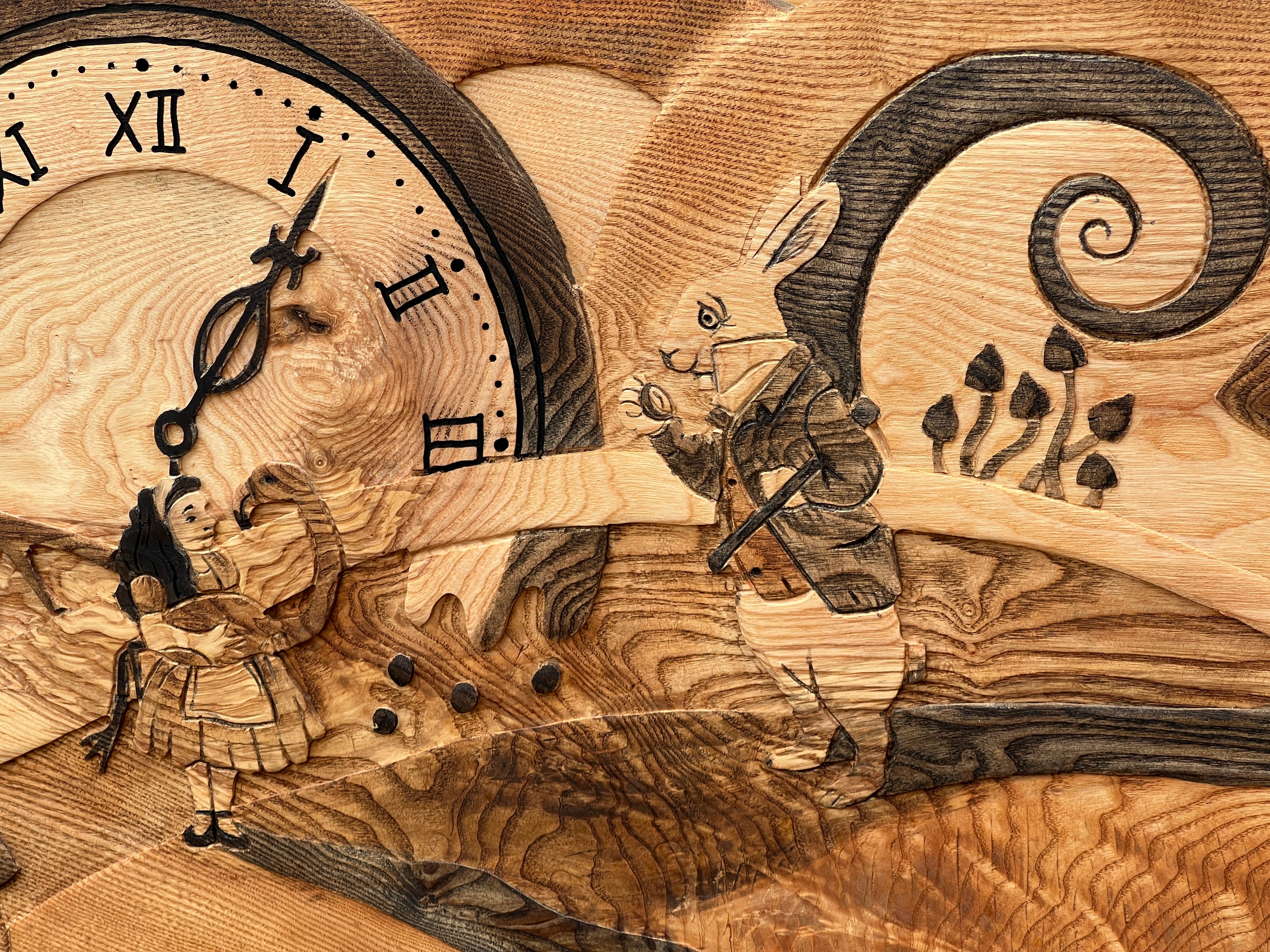 Cheshire Cat, clock, and fantasy scene carved into solid wood bed