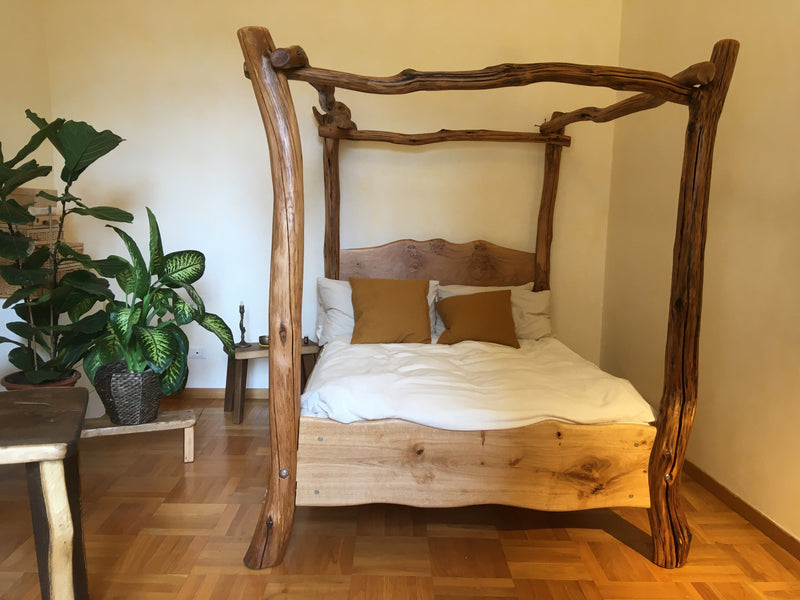 Chunky four poster tree bed