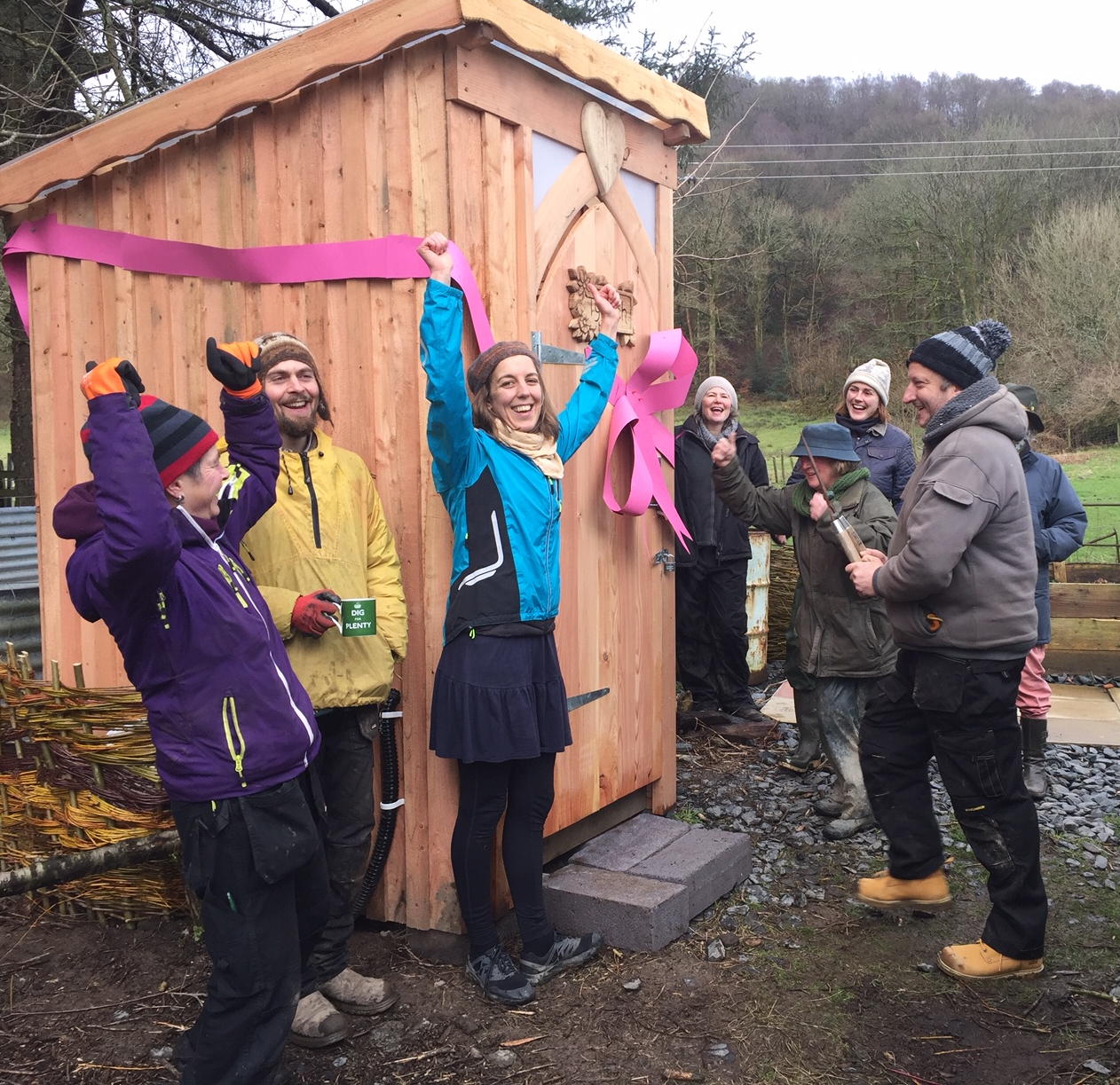Handmade compost toilet installed at a community garden