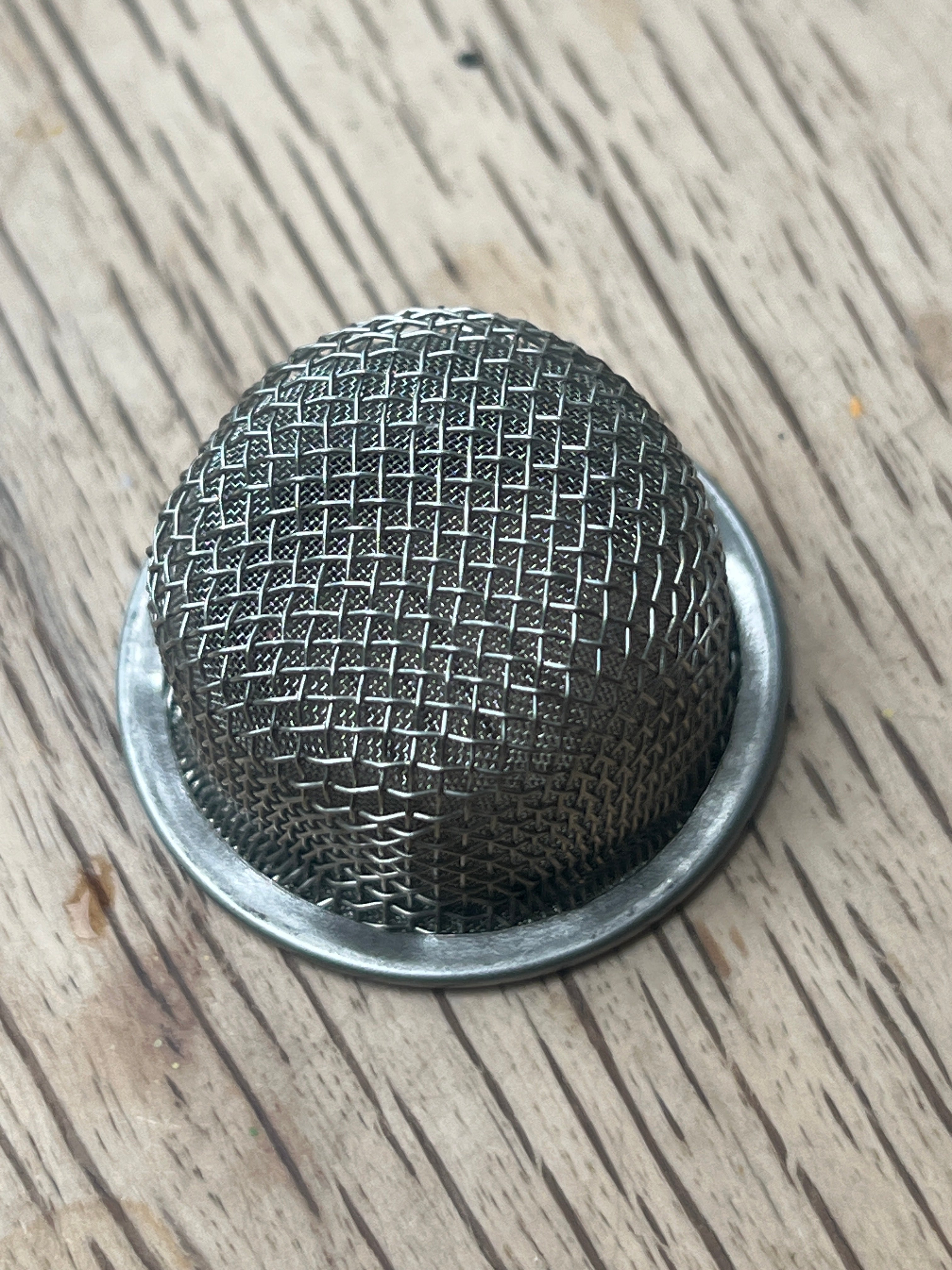 Metal mesh filter for composting toilet urine separator.