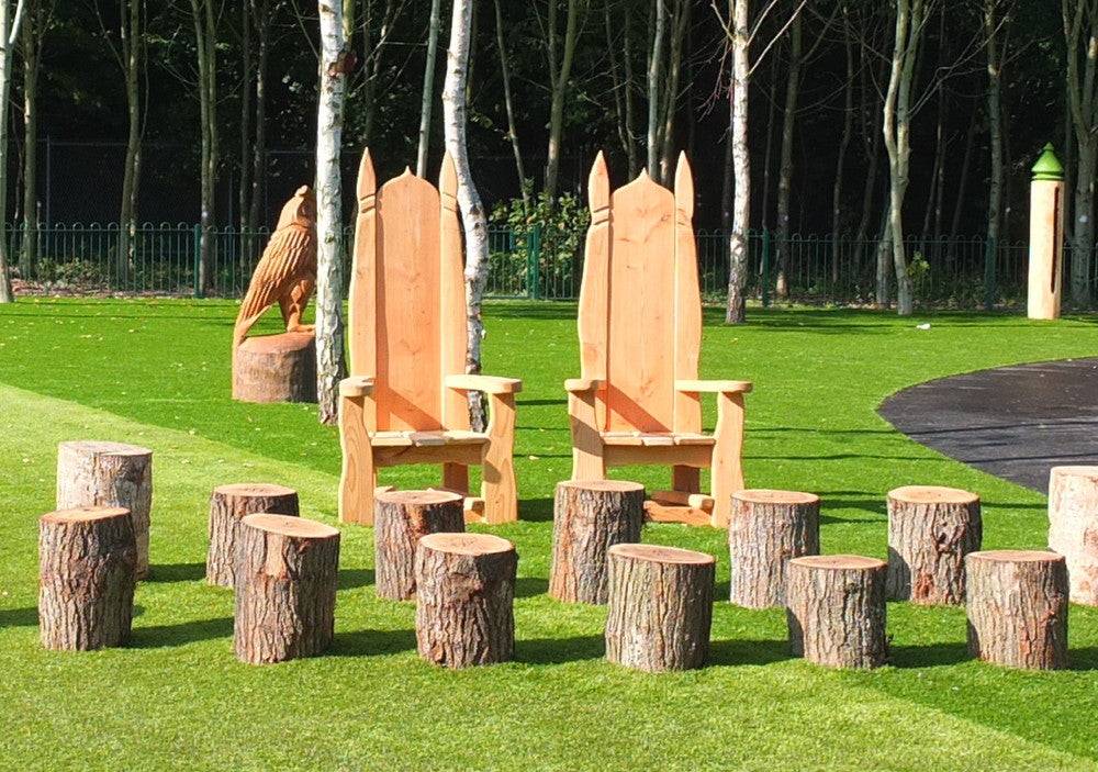Carved oak pixie chair in playground setting — bespoke storytelling throne, Wales