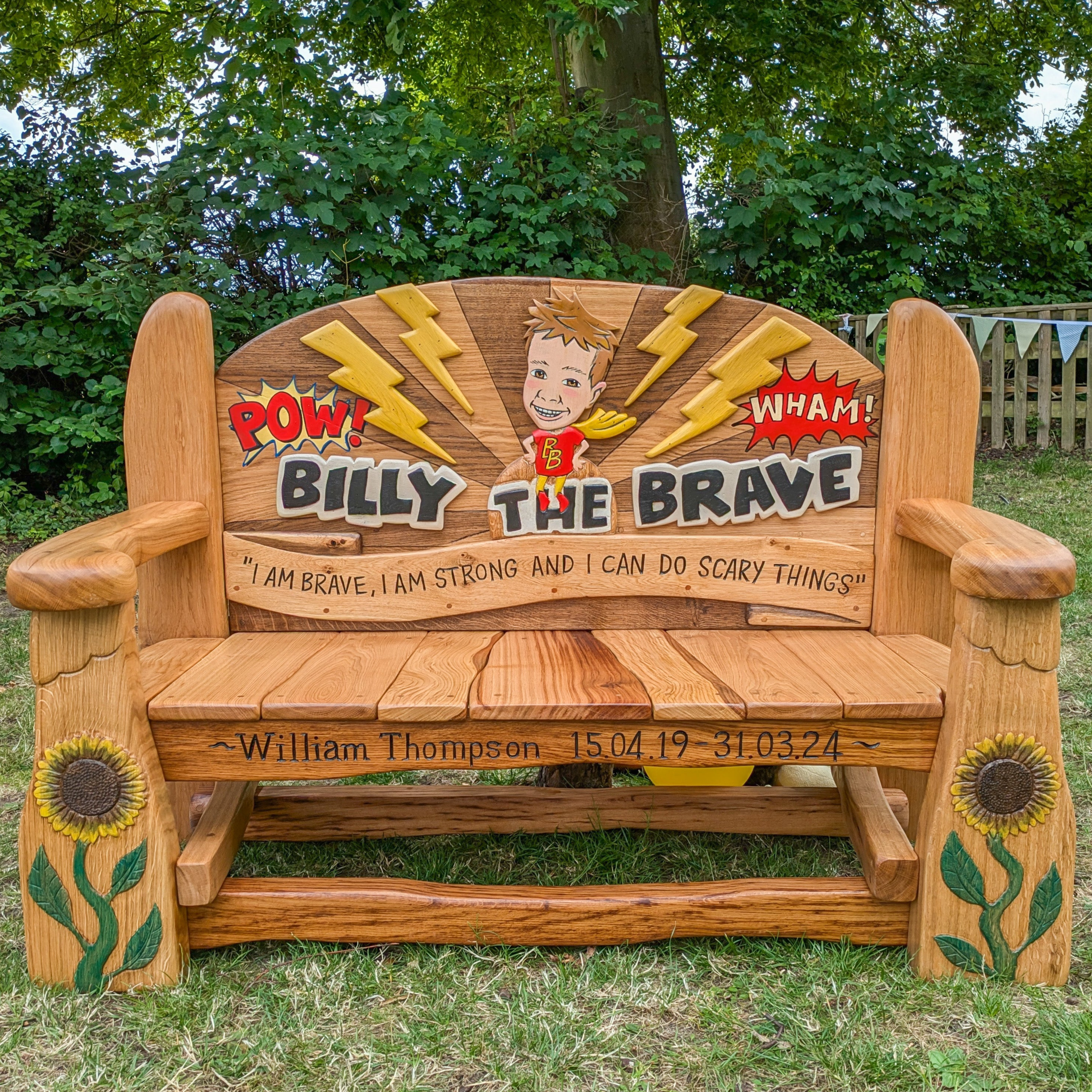 Billy's Memorial Bench with cartoon design and sunflowers