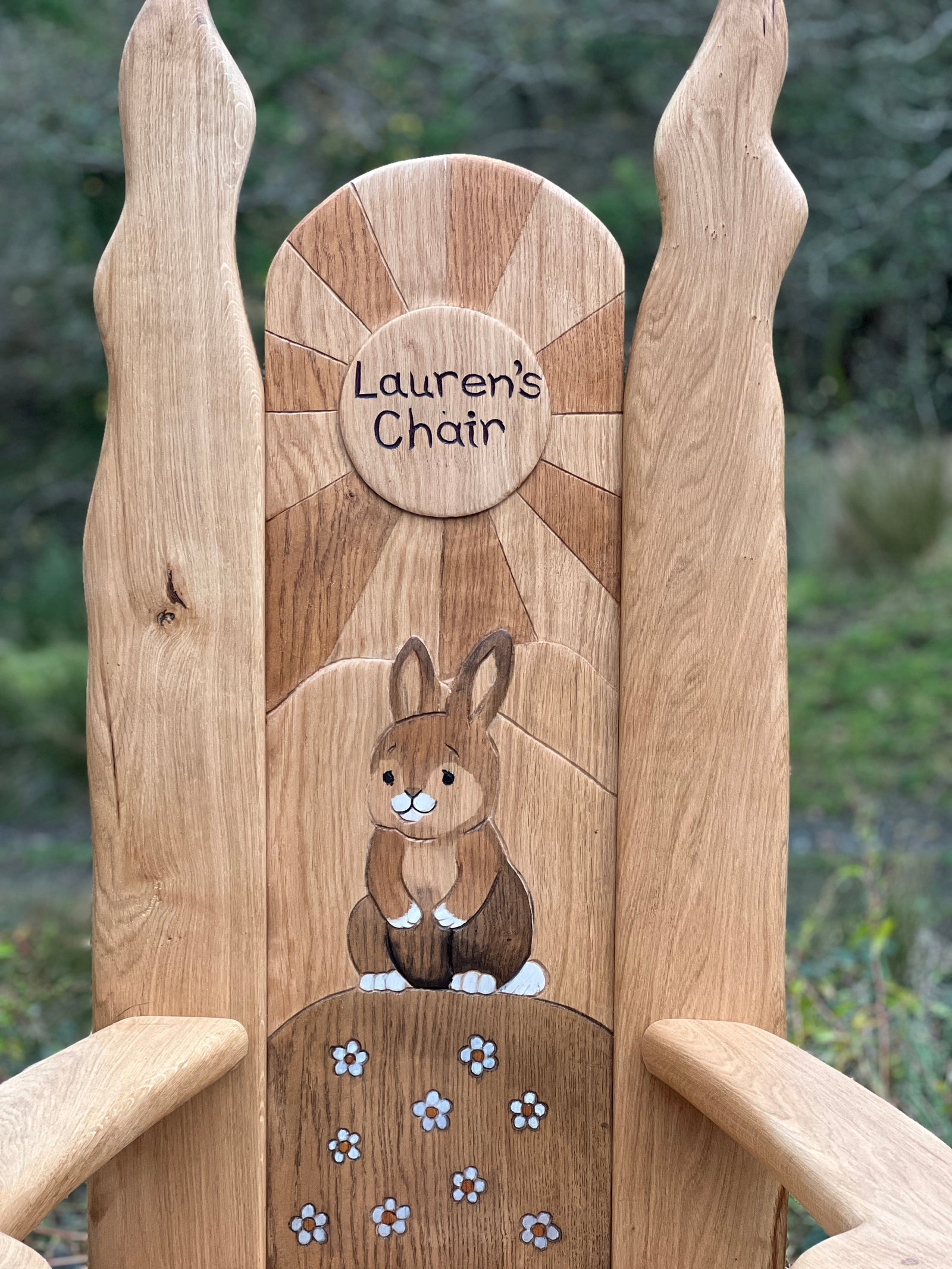 Bunny carving detail on handmade children's reading throne — carved oak, Wales