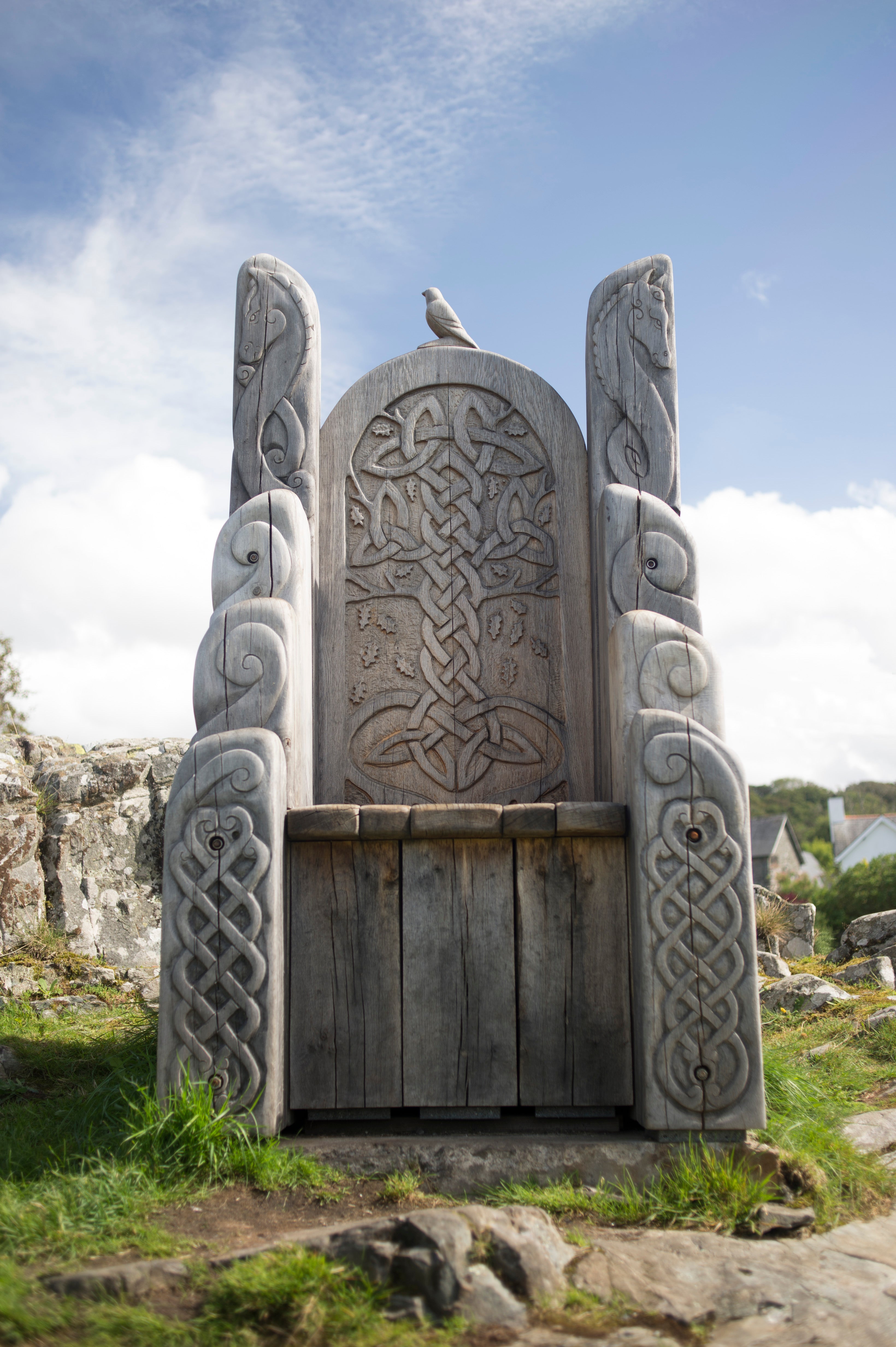 Wooden chair with Celtic carvings and bird