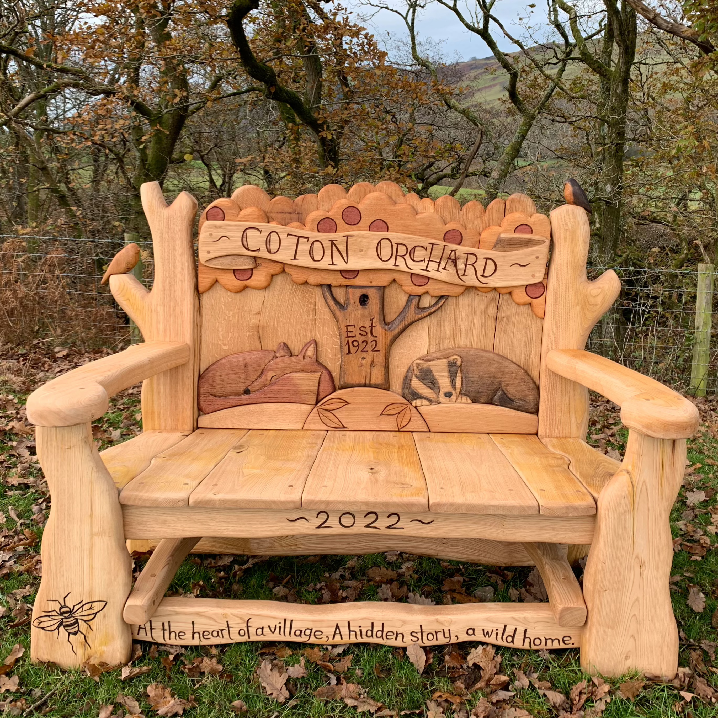 lovely bench with badger and fox sleeping on the backrest