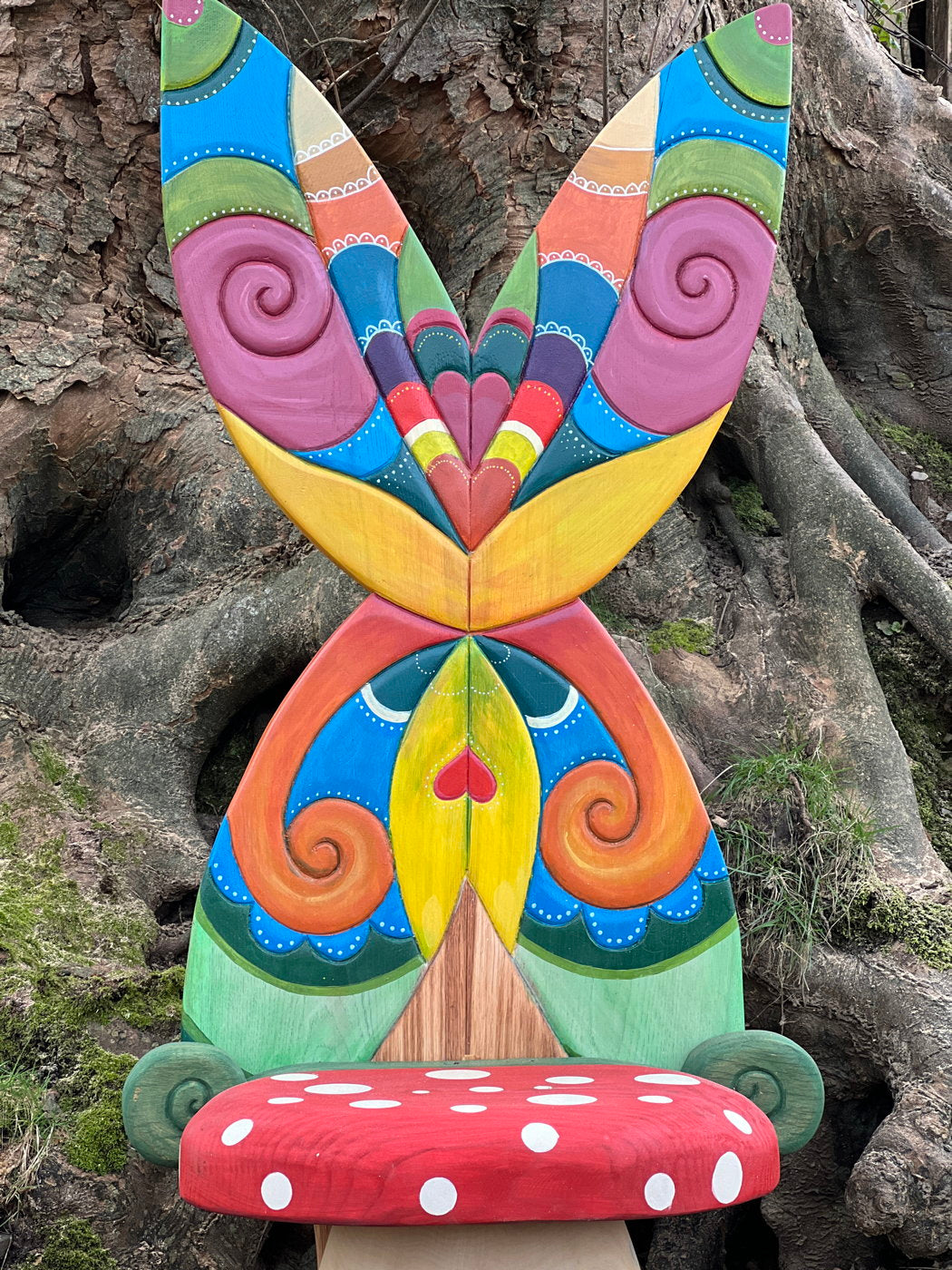 Detailed view of fairy chair's colorful butterfly wings