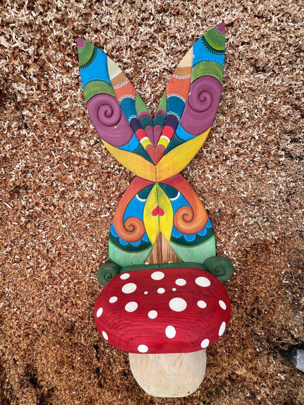 Whimsical mushroom fairy chair with vibrant butterfly wings