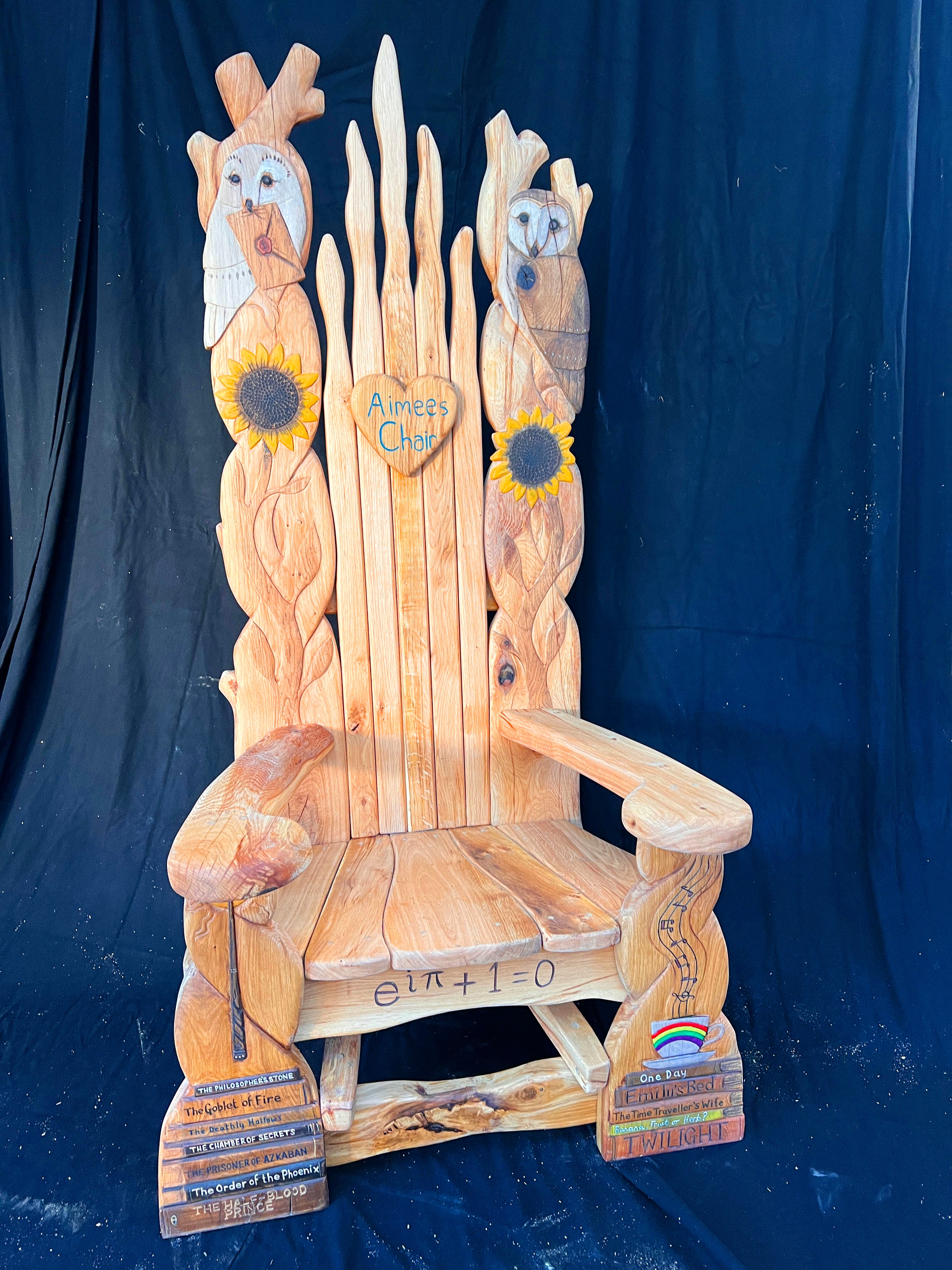 Handcrafted memorial chair featuring Harry Potter books and a tribute to Aimee for a local library.
