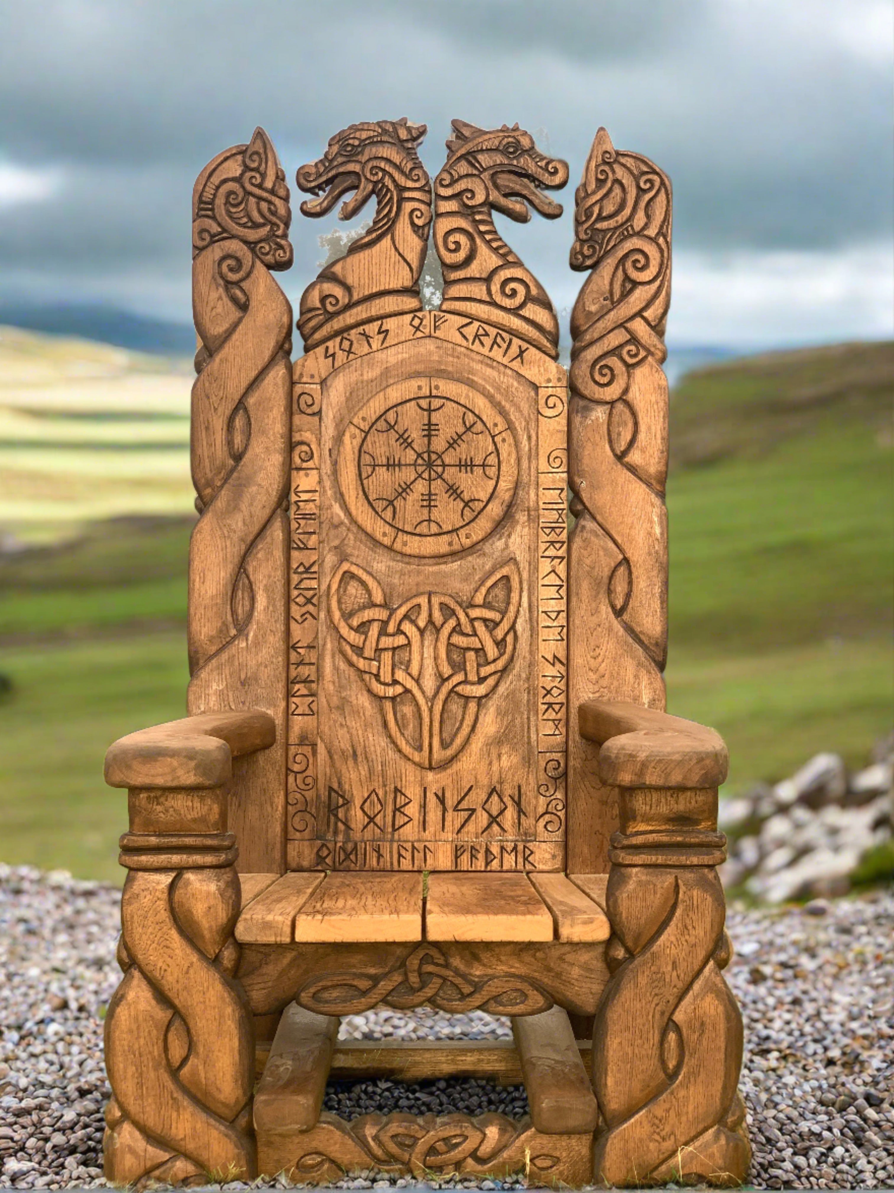 Viking throne with dragon carvings in landscape