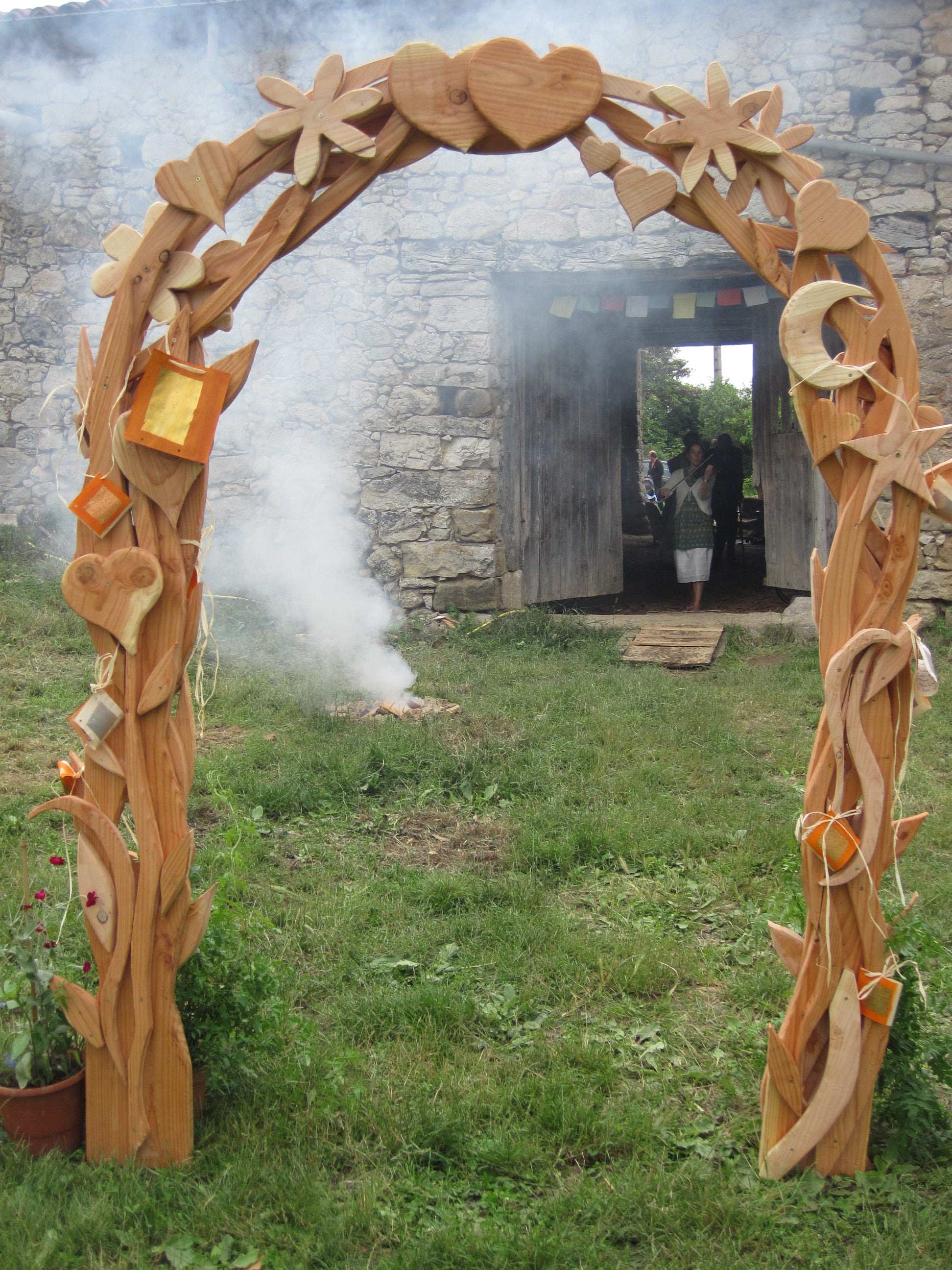 Wooden decorative archway with natural patterns in a garden setting