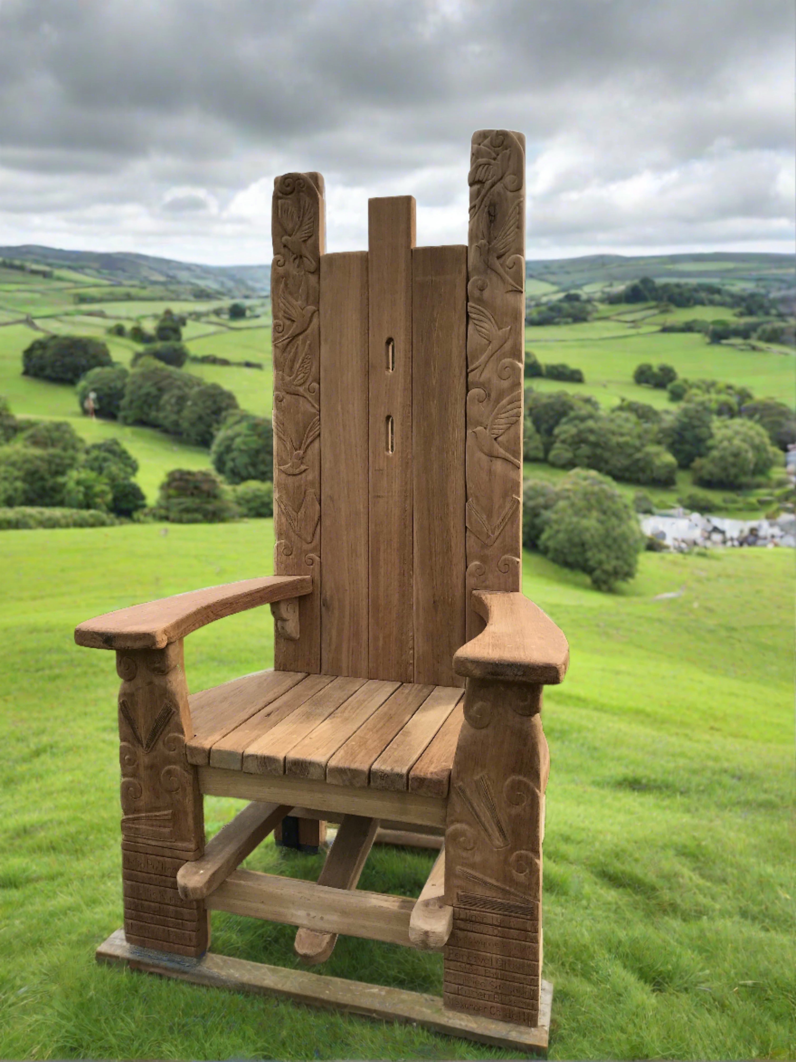 Tall wooden chair with carved details