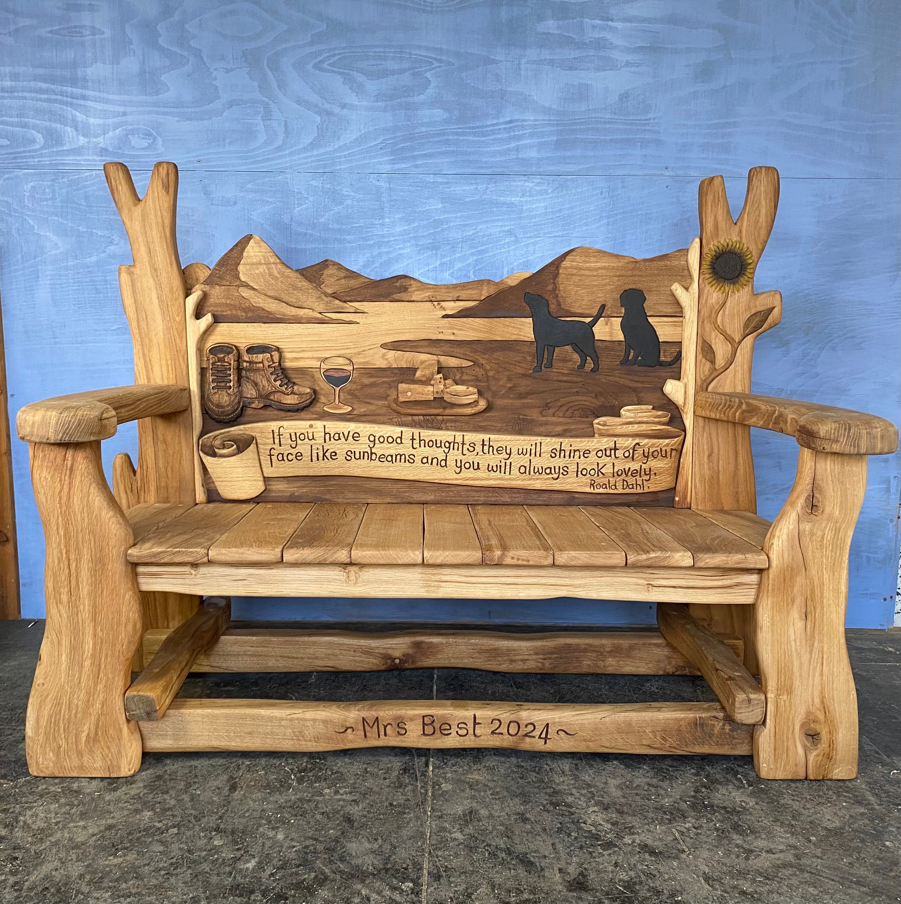 Wooden bench with mountain scene and thoughtful quote.