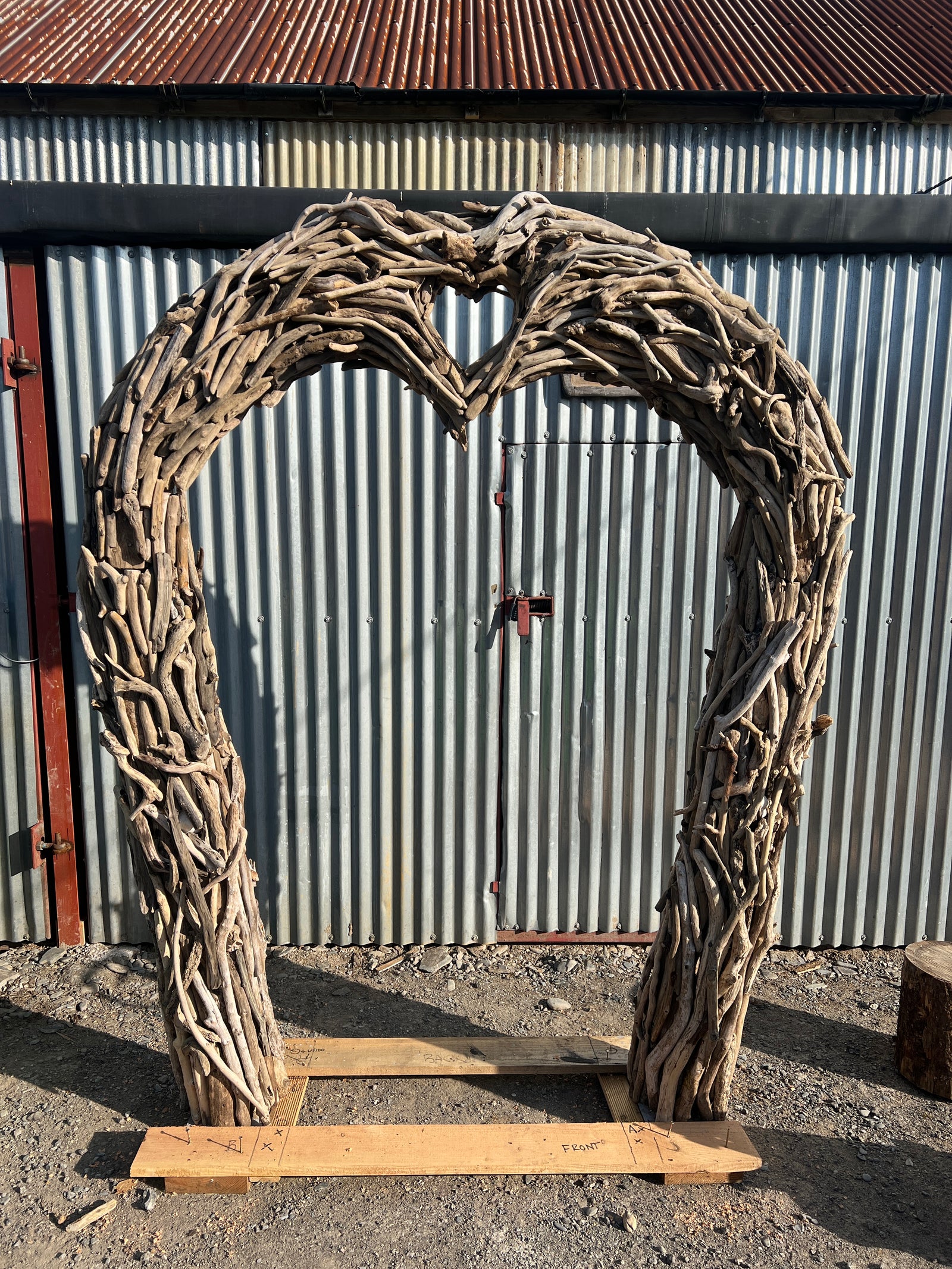 Close-up of driftwood wedding arch branch detail — handcrafted natural wood garden arch, Wales
