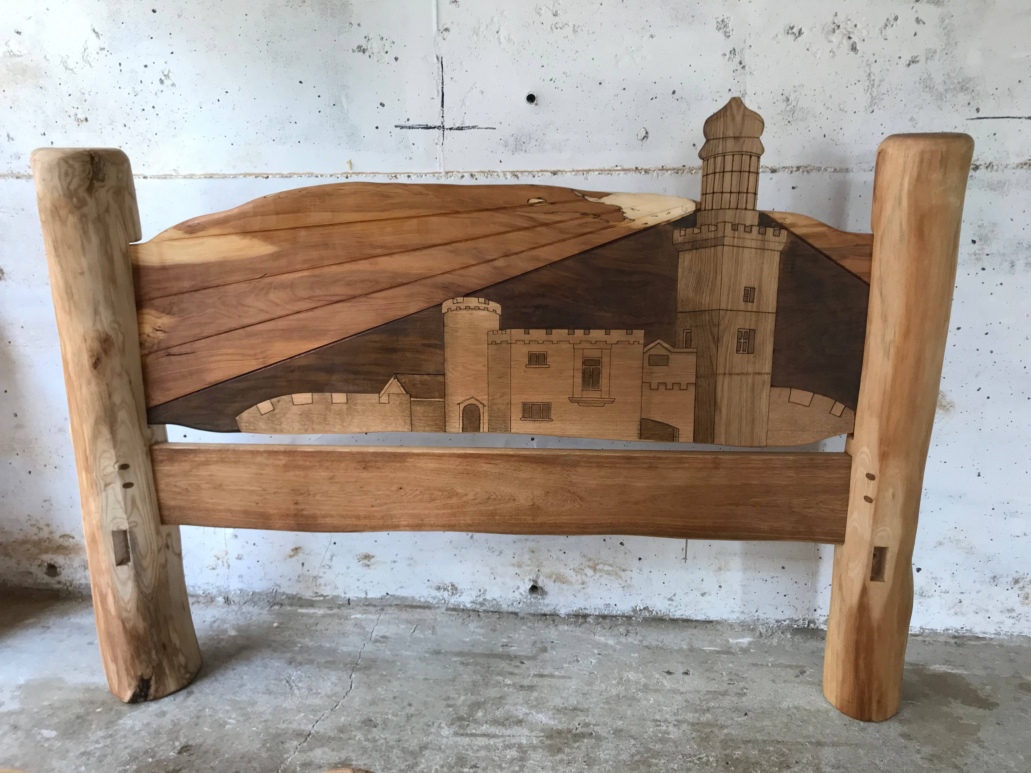 Castle-themed wooden headboard with landscape