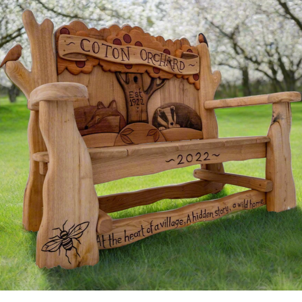 Handcrafted Coton Orchard Bench with wildlife carvings