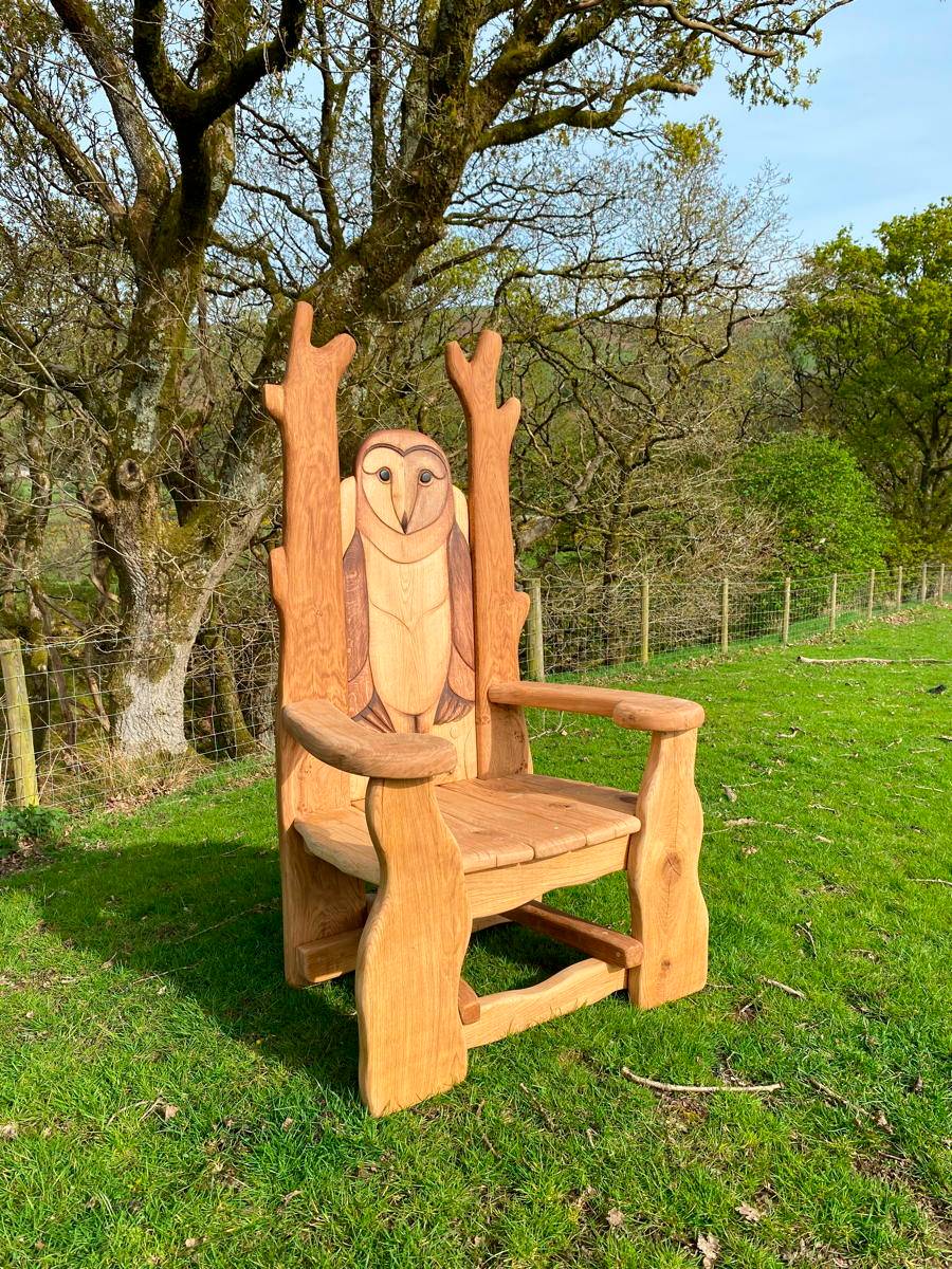 Carved owl chair in outdoor setting