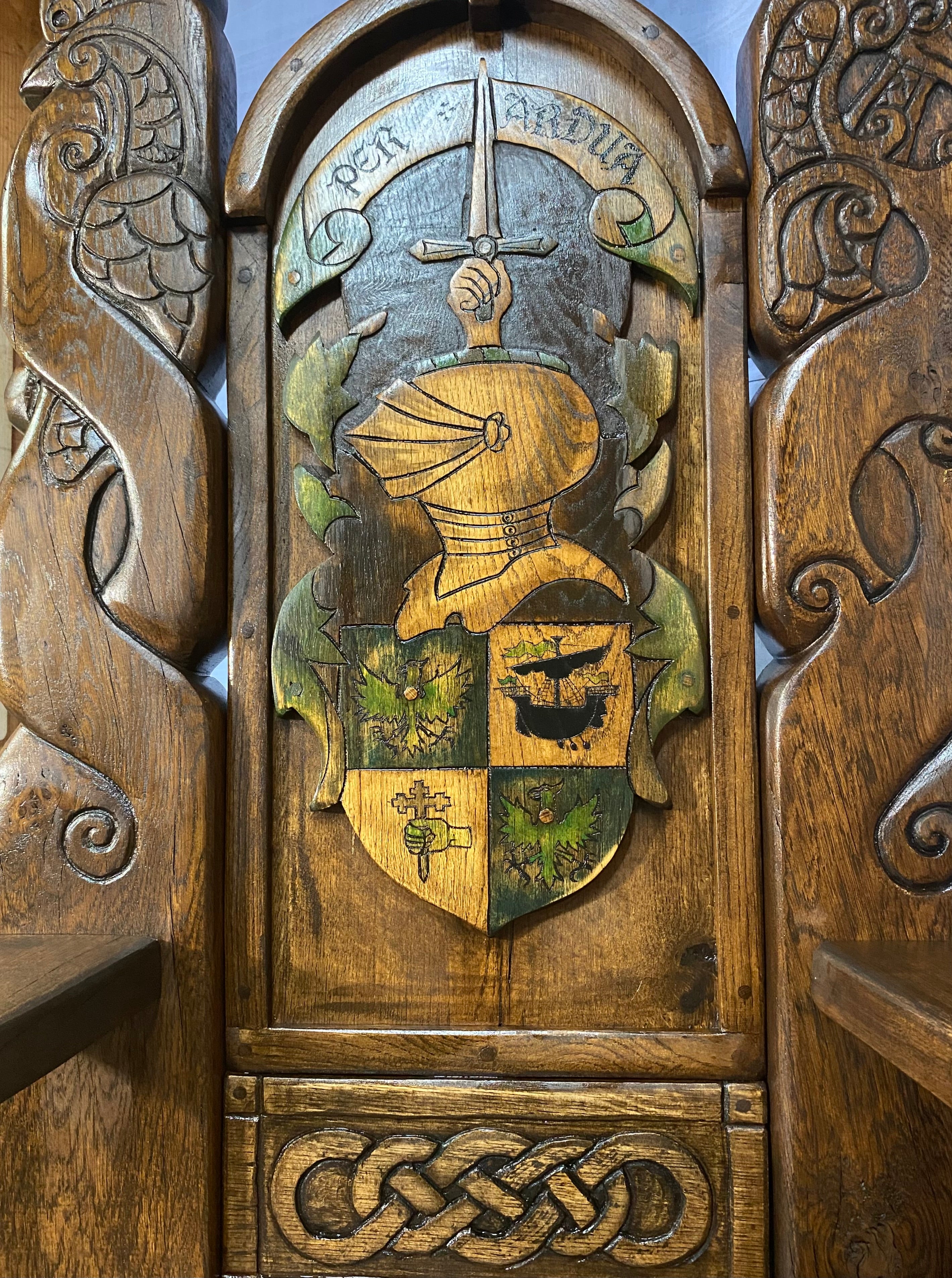 Close-up of knight crest on throne chair