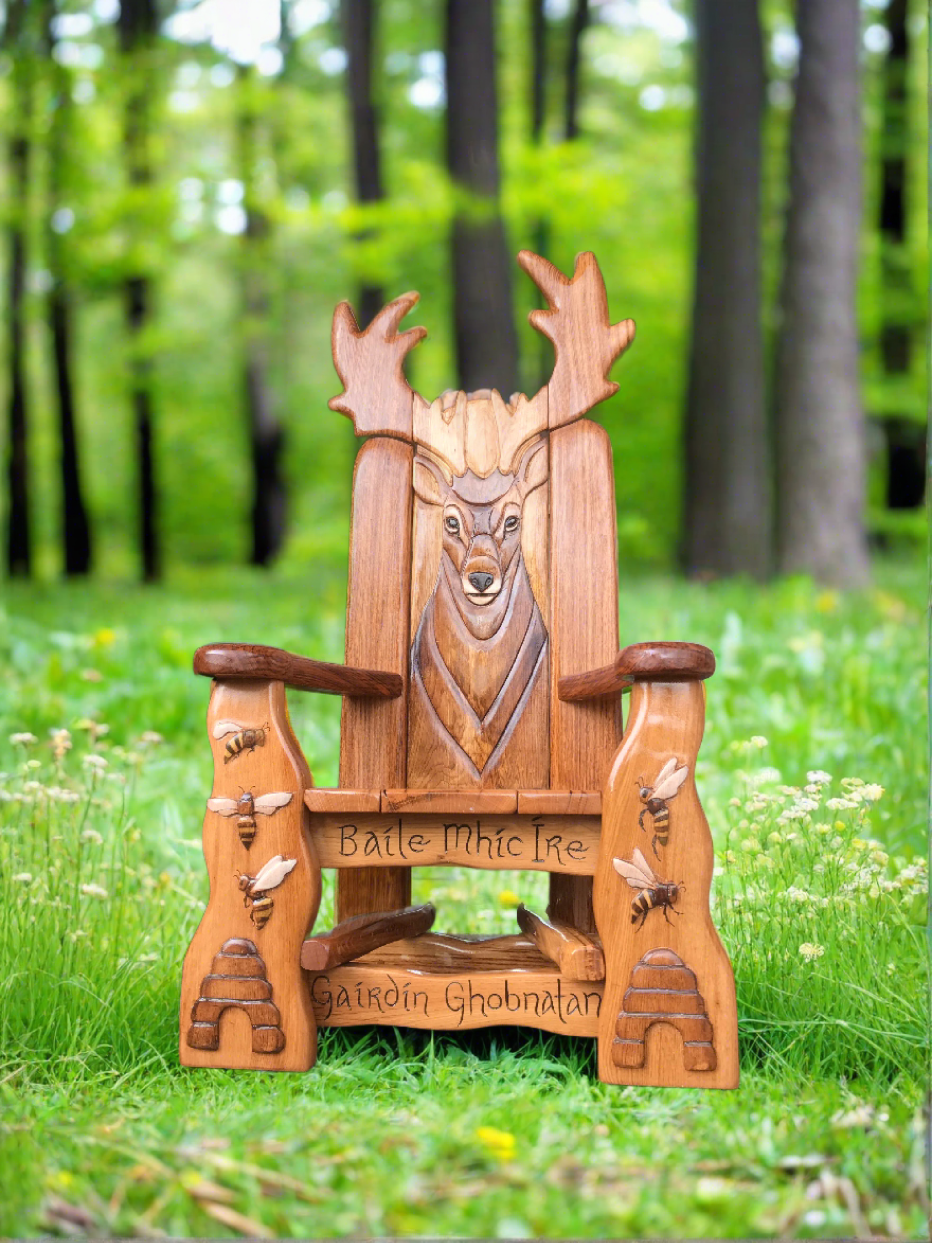 Wooden chair with deer carving in a forest clearing.