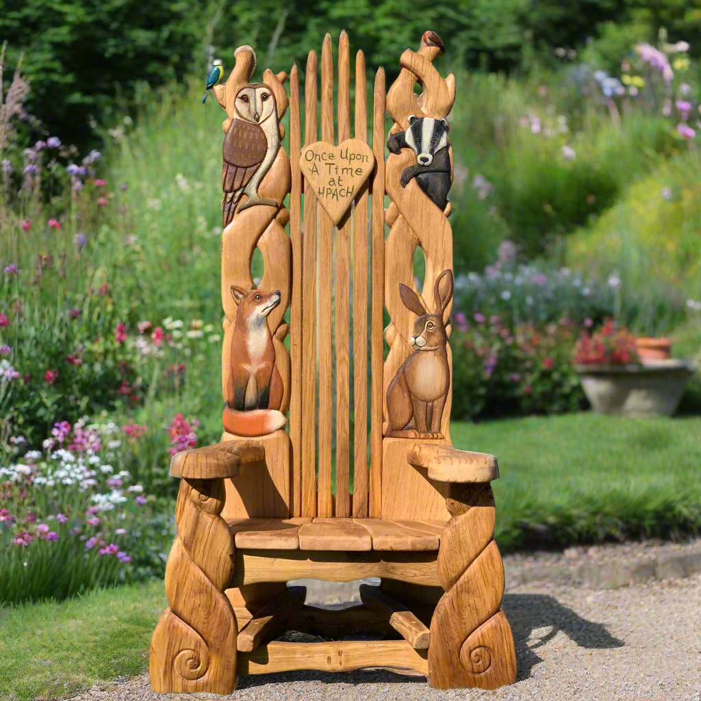 Enchanted Forest Throne, a handcrafted oak storytelling chair featuring intricately carved woodland animals like foxes, owls, and badgers, set against a lush garden backdrop