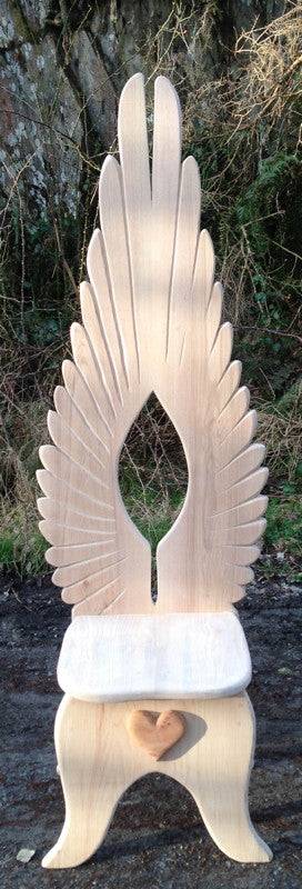 Front view of angel wing carved oak dining chair — bespoke handmade furniture, Wales