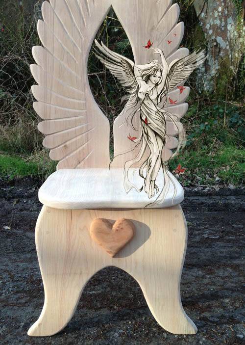 Angel wing fantasy oak story-time chair for schools — bespoke handmade carved furniture, Wales