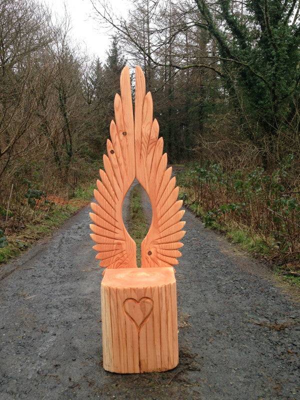 Angel wing storytelling chair in school setting — handmade carved oak reading throne, Wales