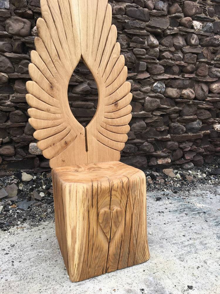 Oak Icarus angel story chair with carved wing back — handmade storytelling furniture, Wales