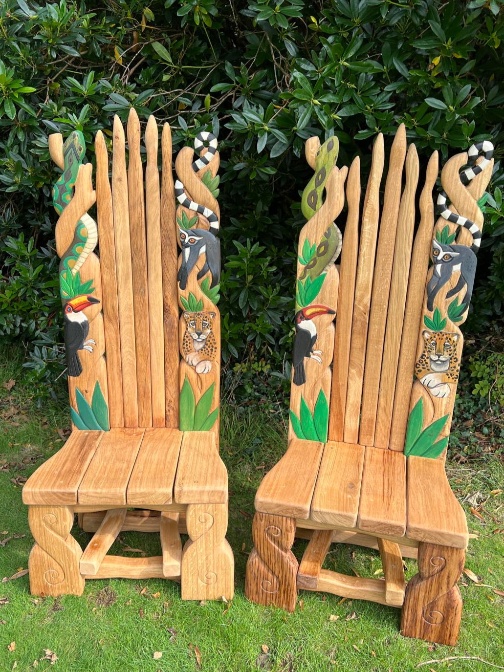 Handcrafted outdoor chair with animal carvings
