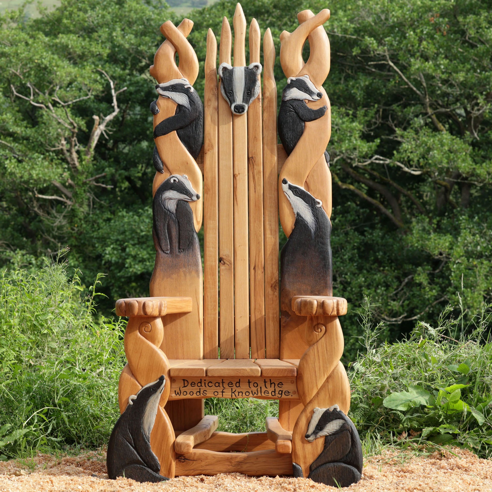 Wooden throne chair with badger figures in a natural setting