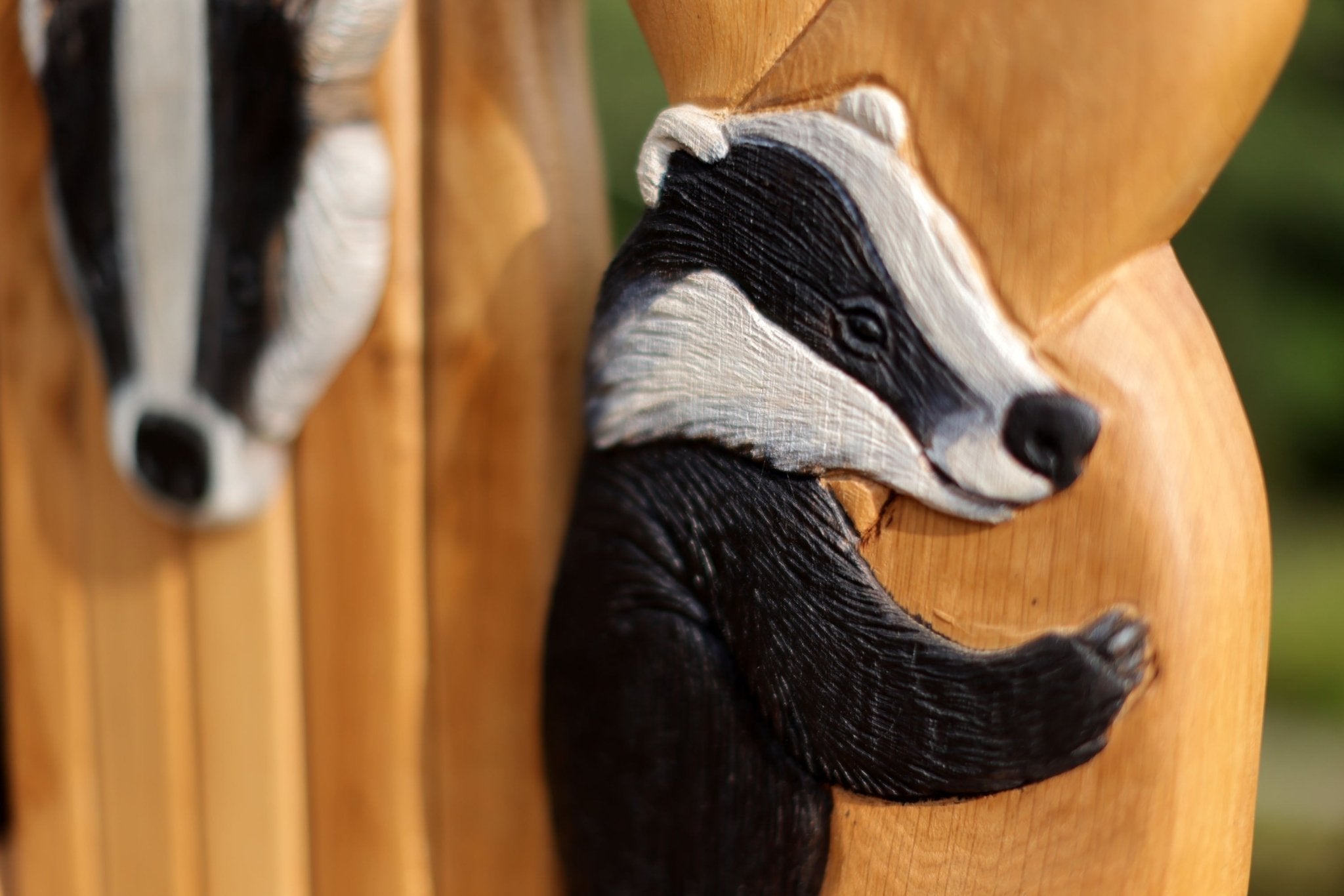 carved badgers on backrest of throne
