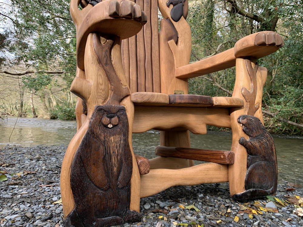Carved oak beaver storytelling chair — bespoke handmade reading throne, Wales