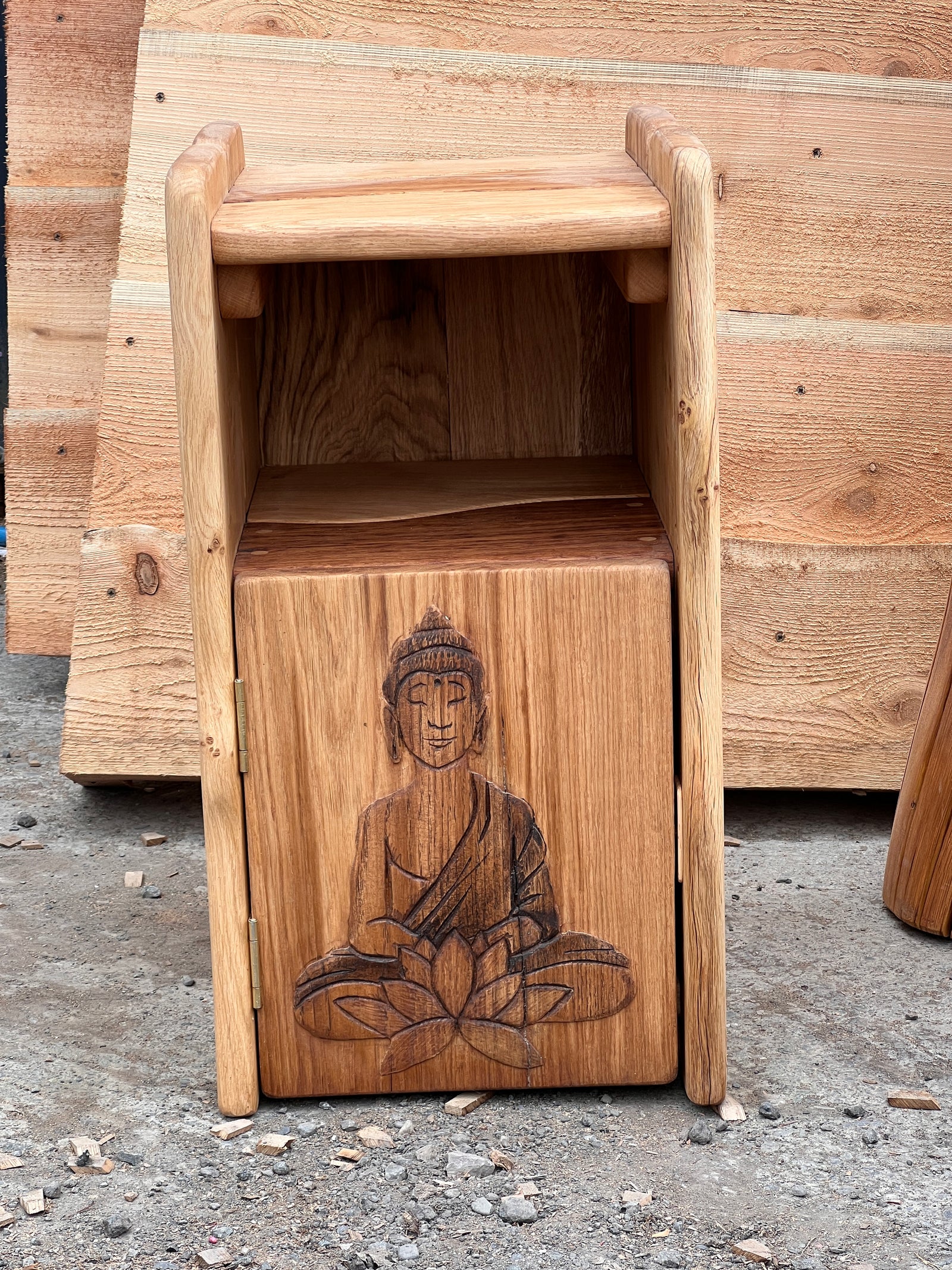 Hand-carved oak bedside cabinets showing witch hat and Buddha carving designs — part of a bespoke furniture commission