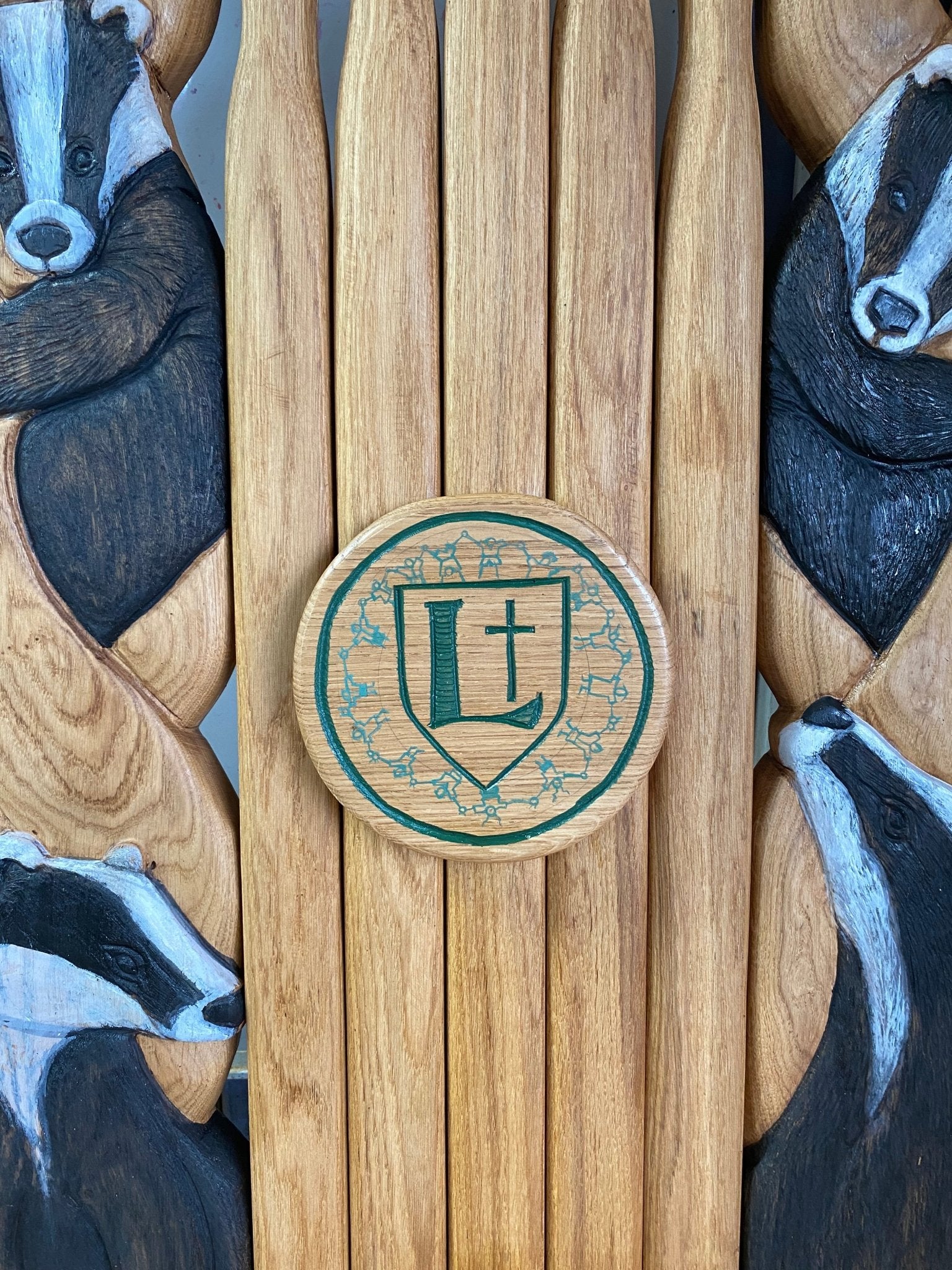 School crest on storytelling chair backrest