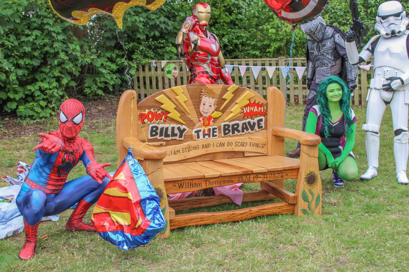 Memorial bench with superhero characters around it