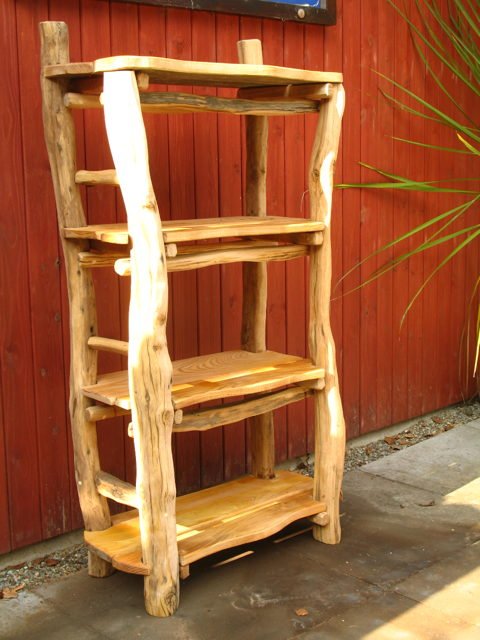 Carved oak bone-shaped shelf unit — handcrafted bespoke wood furniture, Wales