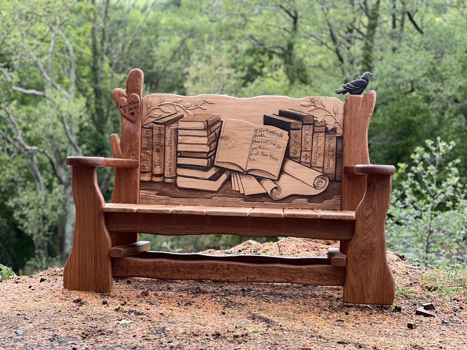 Carved oak book lover's bench, front view showing the library of books on the backrest