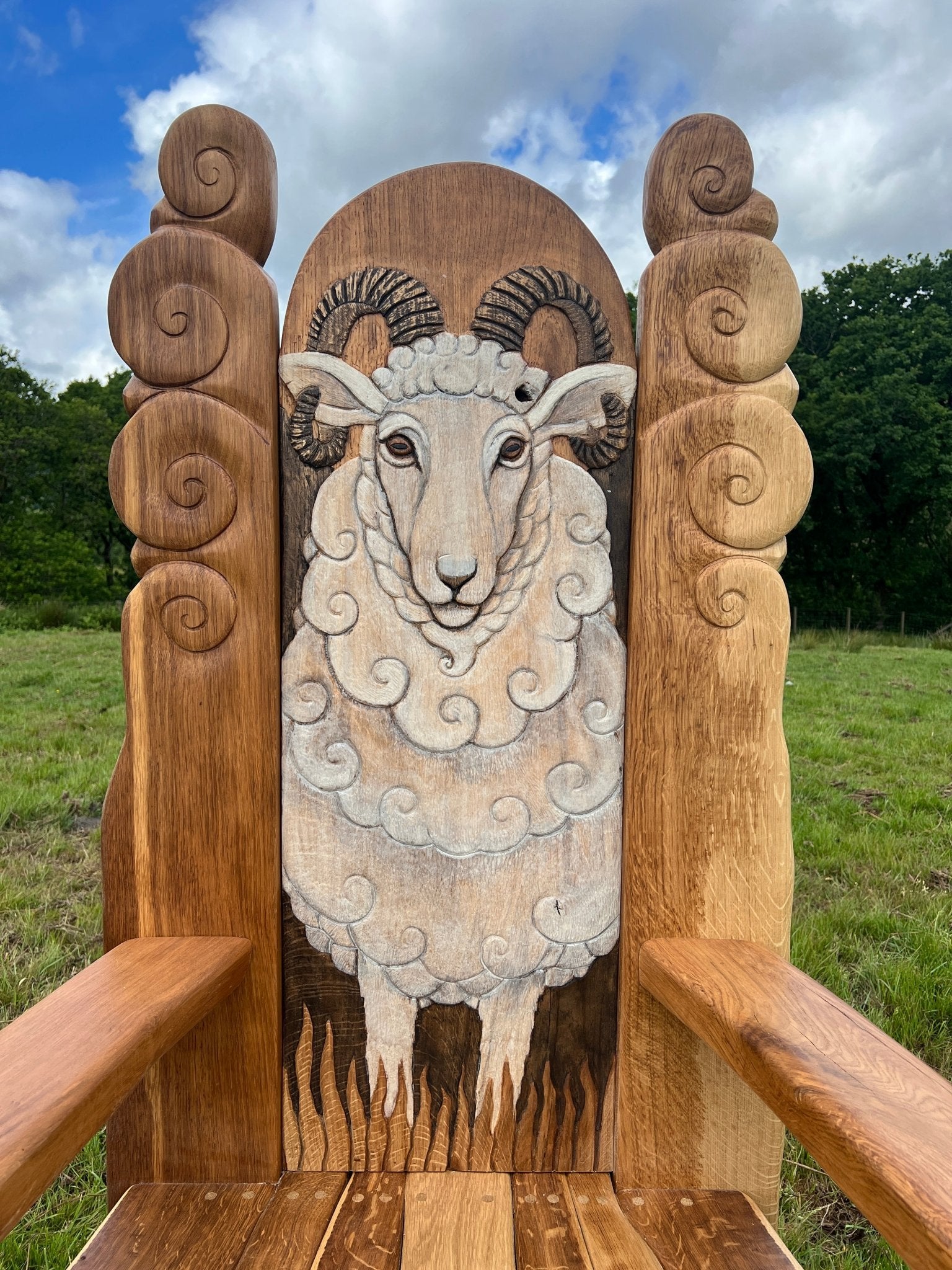 Close-up of carved Swaledale sheep on hand-carved oak chair back — bespoke, Wales