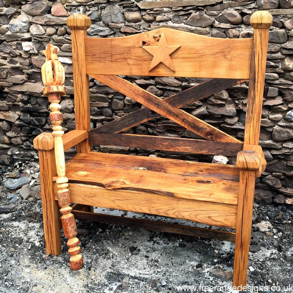 A handcrafted oak garden bench with a carved star design, perfect for outdoor spaces, gardens, and patios, showcasing rustic charm and durability.

