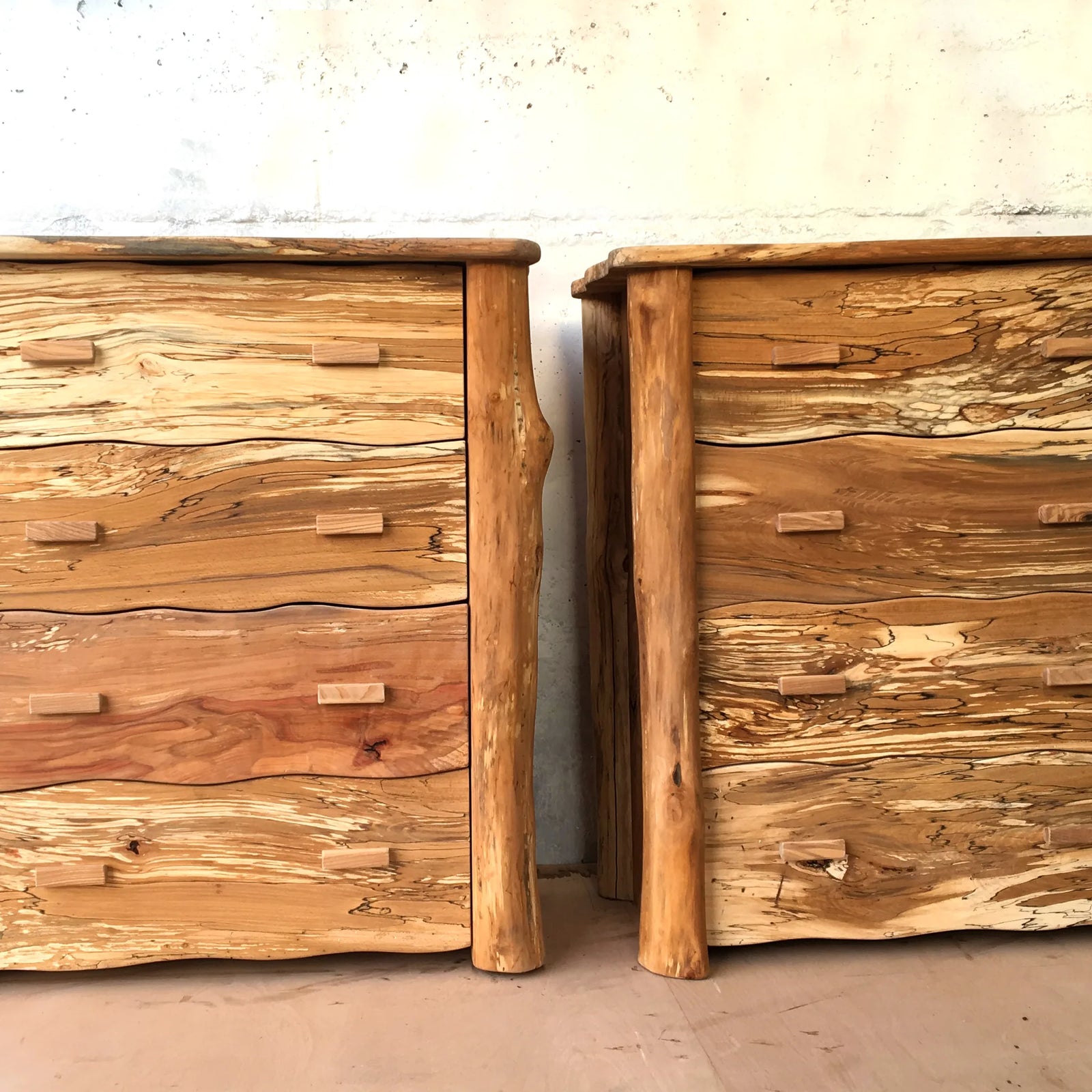 Handmade spalted beech chest of drawers with live-edge log corner posts and four sculpted wavy drawer fronts